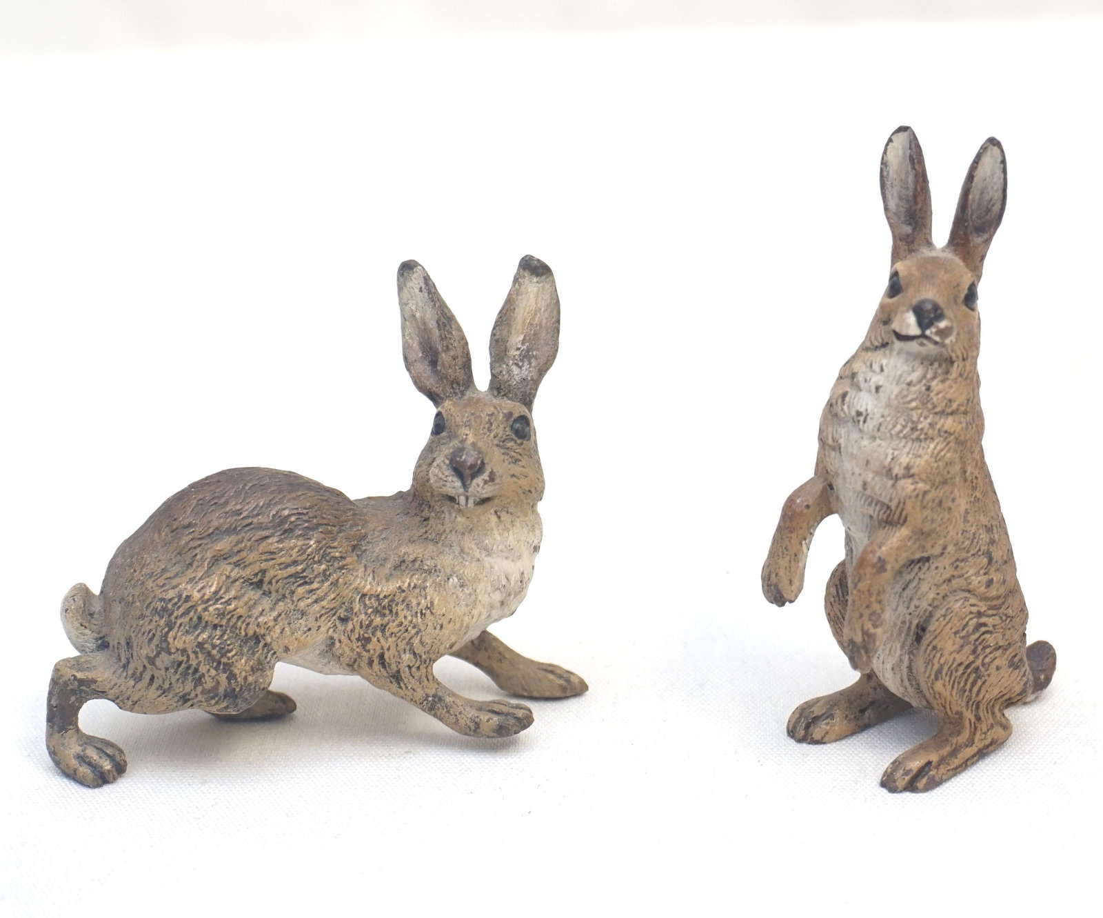 PAIR FRANZ BERGMAN BRONZE COLD PAINTED RABBITS: Two (2) Franz Bergmann Cold Painted Vienna Bronze Rabbits. Early 20th c. Standing Rabbit 2 3/4" tall and Alert Rabbit 2 3/4" long. PROVENANCE: A Private Charleston SC Collection. Franz Xaver Bergman (