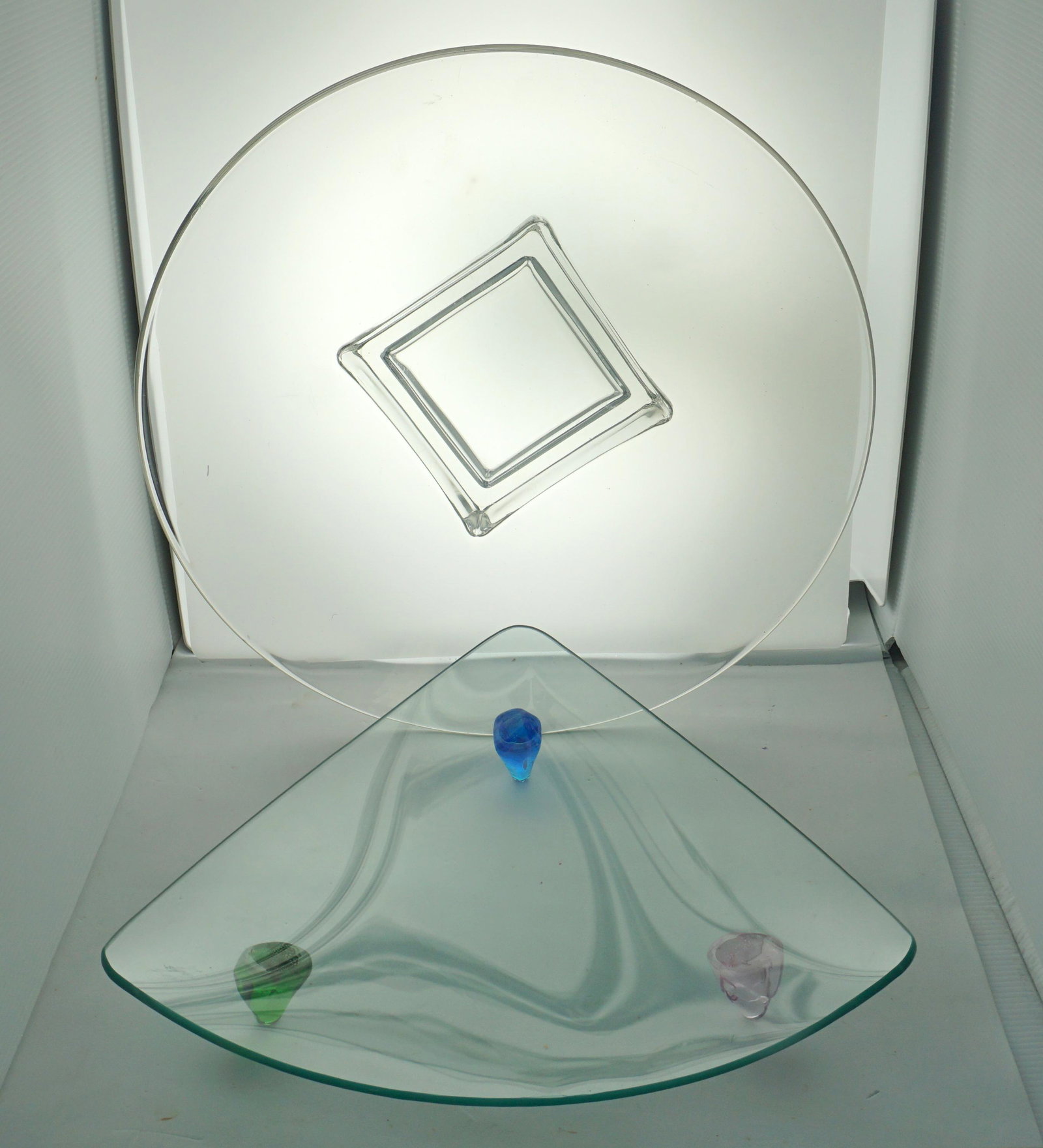 2 CONTEMPORARY GLASS BOWLS: 2 Contemporary Glass Bowls. 1- Large 16"x16"x 4". 2- Triangle Bowl with multi Colored Feet 13 1/2"x13 1/2". Weight 9 pds 8 oz. PROVENANCE: A Private Charleston SC Estate.NO IN HOUSE SHIPPING Shipping 