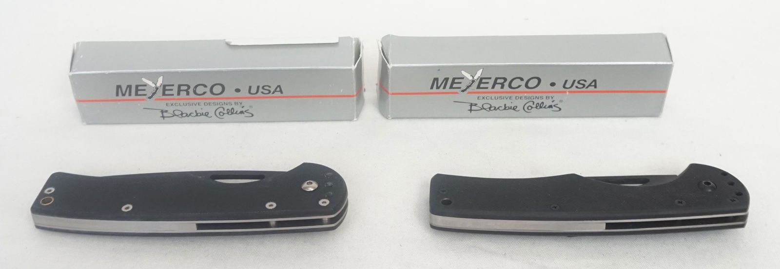 2 BLACKIE COLLINS MYERCO KNIVES IN BOXES: 2 Myerco USA Knives Exclusive Design by Blackie Collins. Both in the original Boxes. Unused. Both with Black Handles and Tanto Blades, 1 with Titanium and Tanto. Each folded 5" and Opened 8 1/2". Weig