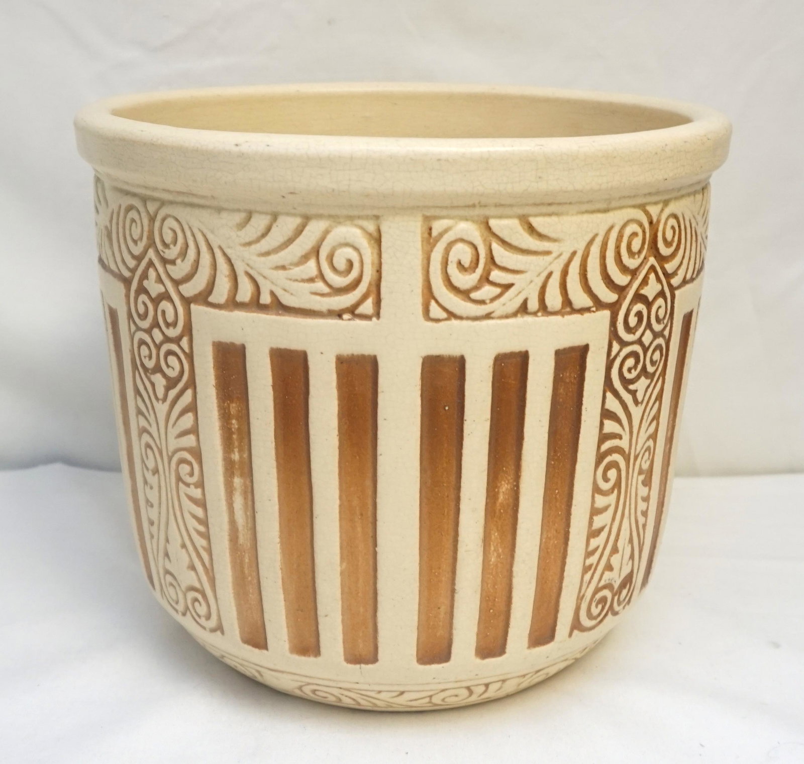 AMERICAN POTTERY IVORY JARDINAIRE: Vintage American Pottery Ivory Arts & Crafts Style Jardinaire. Possibly Weller. Unmarked. Measures 10 3/4"x10 3/4"x9 1/2". Weight 7 pds 8 oz.NO IN HOUSE SHIPPING. PROVENANCE: A Private Charleston SC E