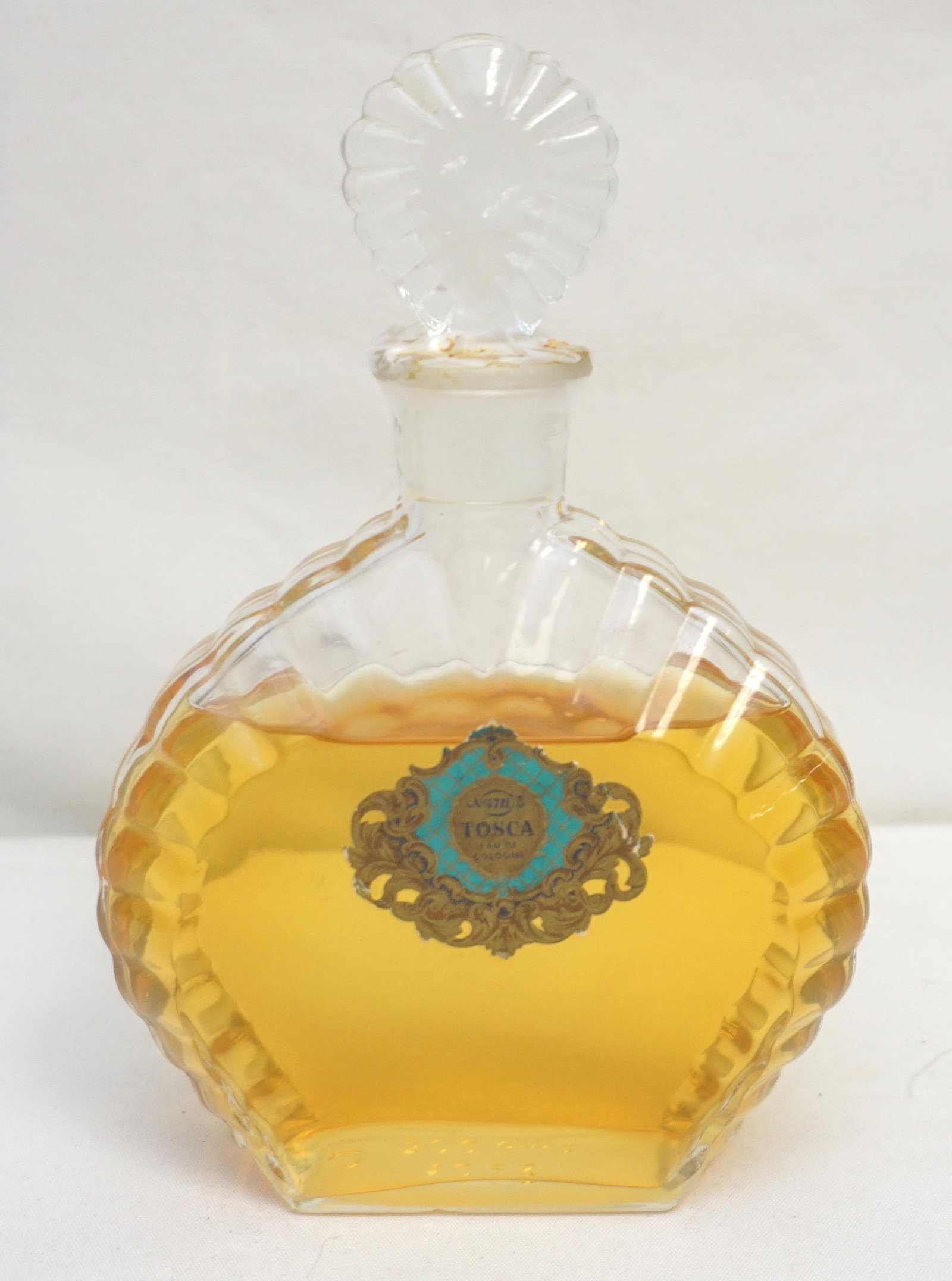 VINTAGE "NO. 4711 TOSCA" EAU DE COLOGNE: Vintage 1950s Tosca "No. 4711" Perfume Bottle. Original Foil Label. Opened. Measures 5"x 2 3/4"x7". Weight 1 pd 8 oz. 4711 is a traditional German Eau de Cologne made by MÃ¤urer & Wirtz. Because it 