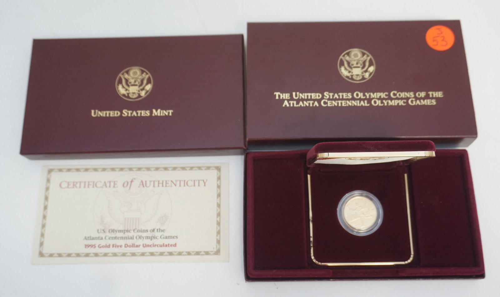 1995 ATLANTA CENTENNIAL OLYMPIC $5 US GOLD COIN: One $5 US gold 1995 Atlanta Centennial olympic games gold uncirculated coin. Coin is in original box, sleeve and with COA. Total weight approx. 12oz.