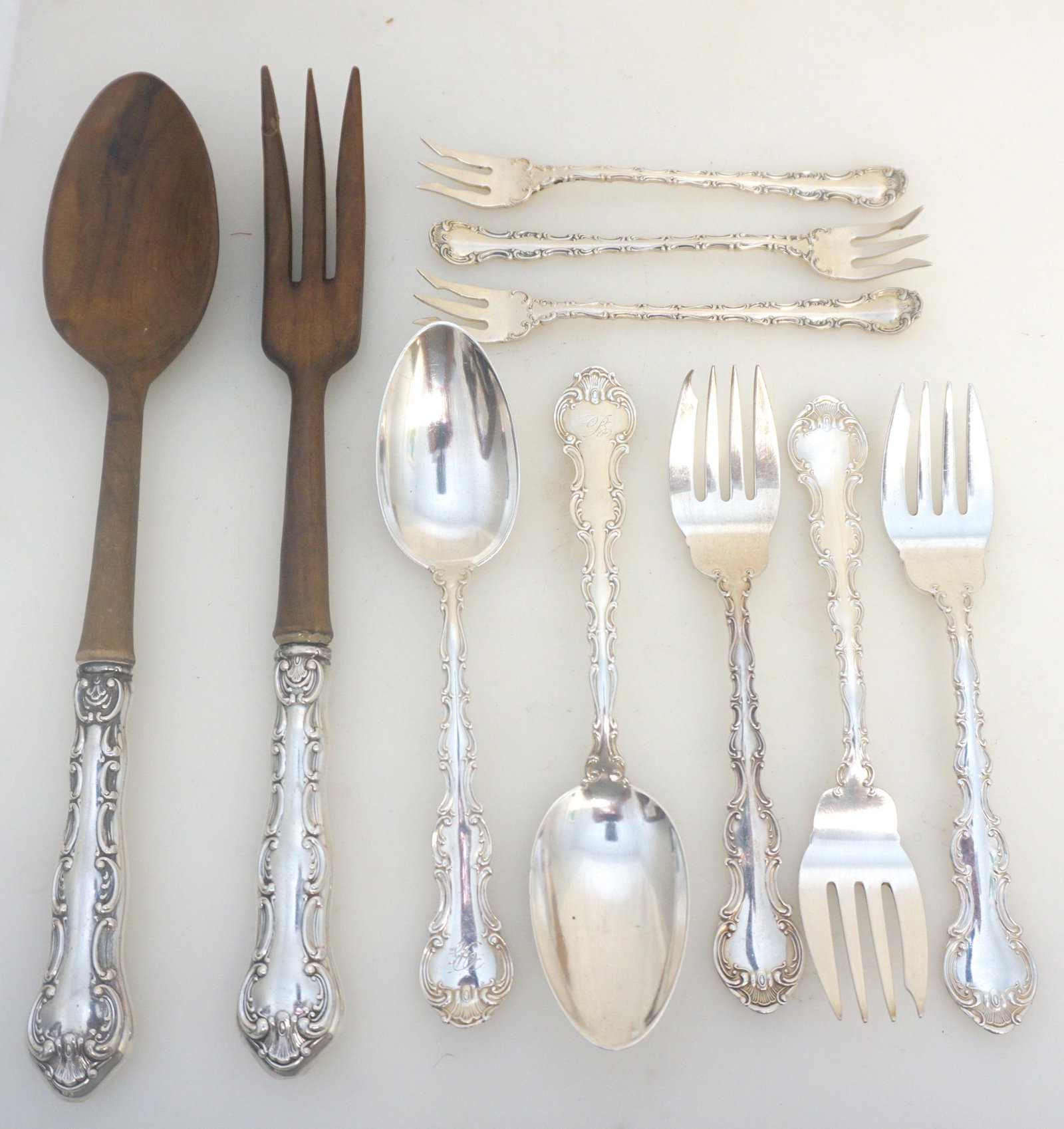8 GORHAM STERLING SILVER STRASBOURG: 10 Pieces of Gorham Sterling Silver Strasbourg. 3 Oyster Forks no monograms 5 5/8". 3 Salad Forks no monograms 6 3/8". 2 Dessert Oval Spoons, monogrammed 7 1/8". Wooden Bowl Sterling Handle 2 Piece Sa