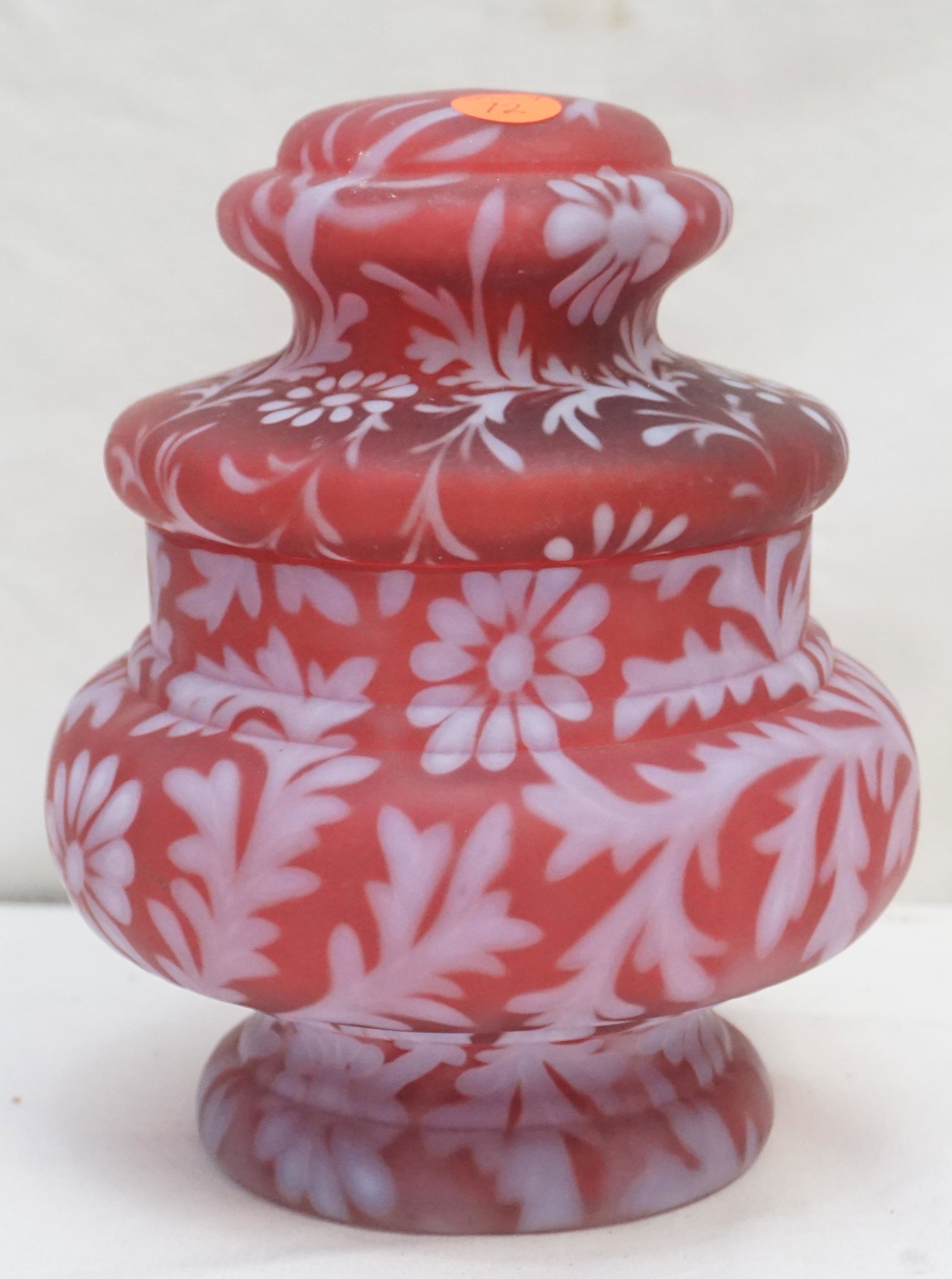 FENTON CRANBERRY DAISY & FERN APOTHECARY JAR: Rare Cranberry Daisy & Fern Apothecary Jar by Fenton for L.G. Wright.. Measures 8". Weight 2 pds 7 oz. Good condition.. PROVENANCE: A Charleston SC Private Estate