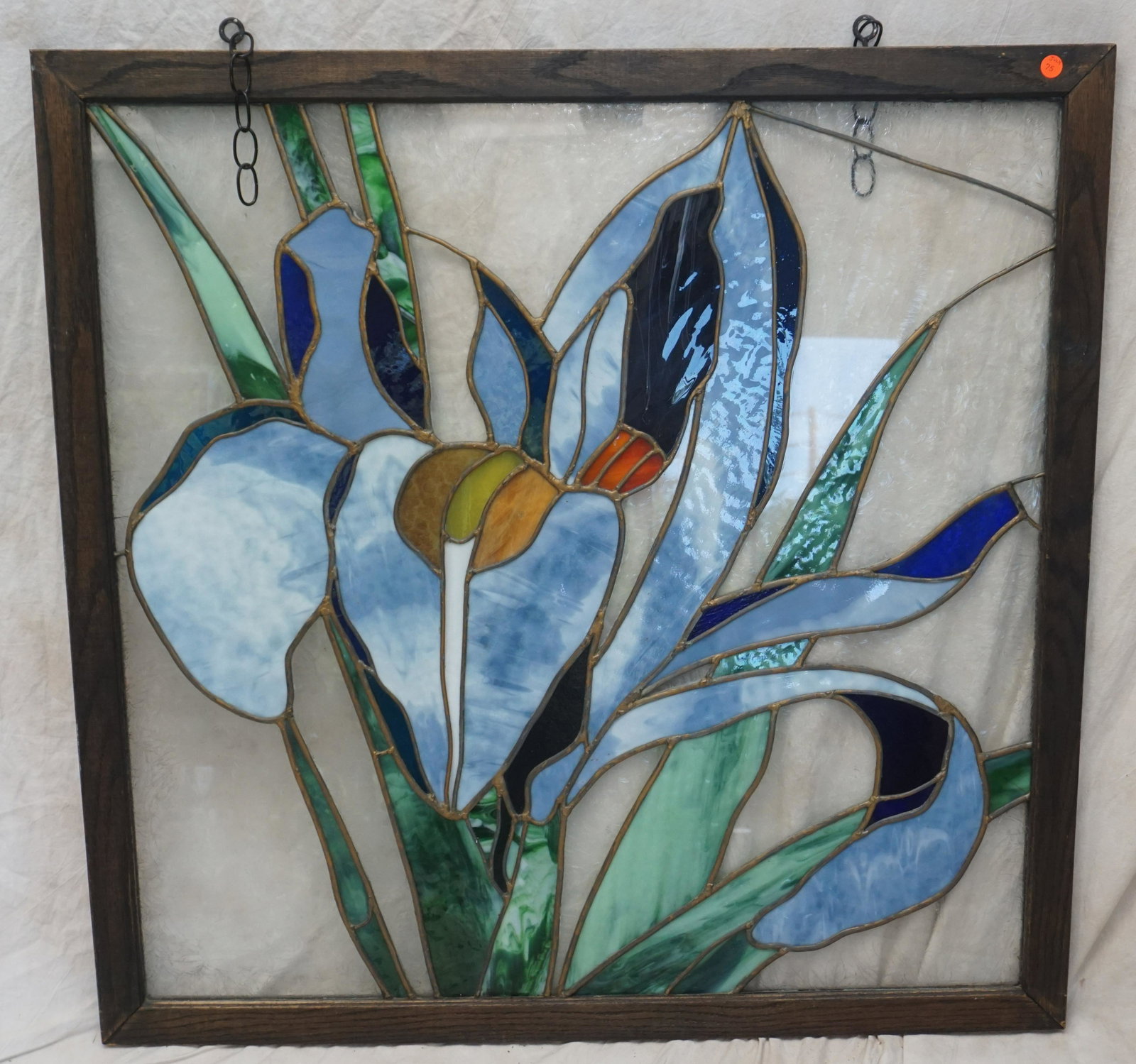 STAINED GLASS WINDOW BLUE IRIS: Contemporary 20th c. Leaded Stained Glass Window. Blue Iris. Measures 38"x38"x1 1/4". NO IN HOUSE SHIPPING. PROVENANCE: A Private Charleston SC Estate.***Pickup only or Shipping on this item offered t