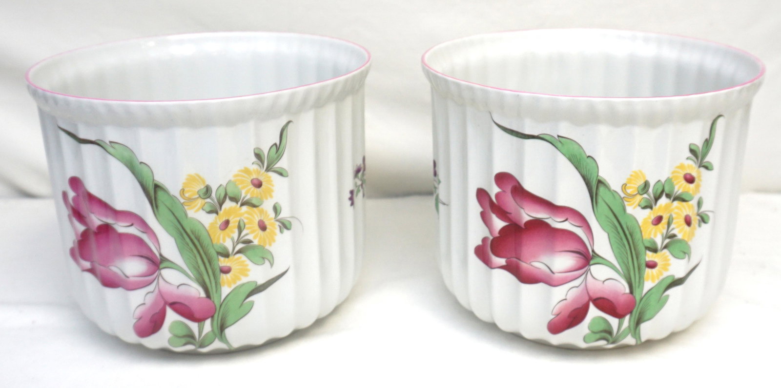 PAIR SPODE JARDINAIRES / PLANTERS: Pair of Spode Fluted Jardinaire / Planters with Florals. Each 8 1/2"x8 1/2"x7". Weight on both combined 5 pds. PROVENANCE: A Private Charleston SC Estate.