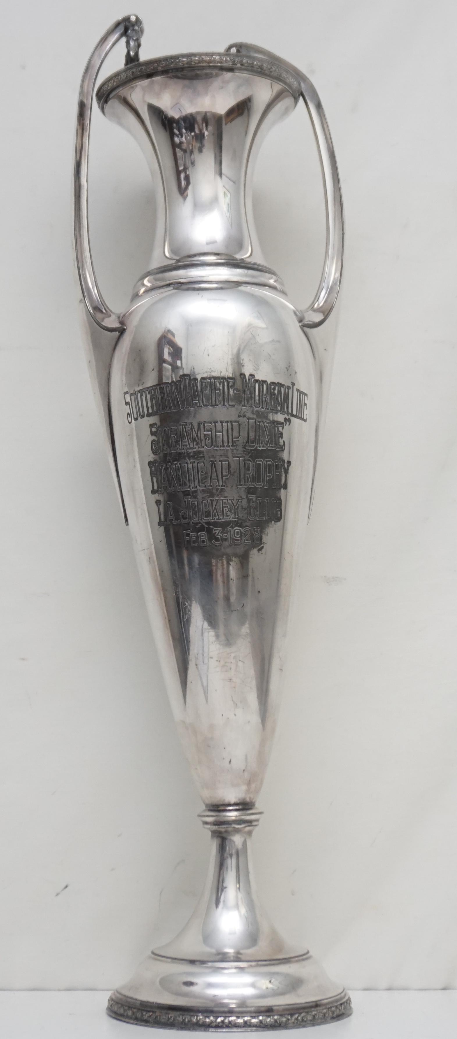 LARGE 1928 HORSE TROPHY SILVERPLATED: Large Meridian Silver Plated Horse Racing Trophy from February 3, 1928, won by the Camden Family of Kentucky. Measures 7 "x5 1/2"x26 1/2". One hoop on handle needs to be repaired. Weight 6 pds. PROVEN