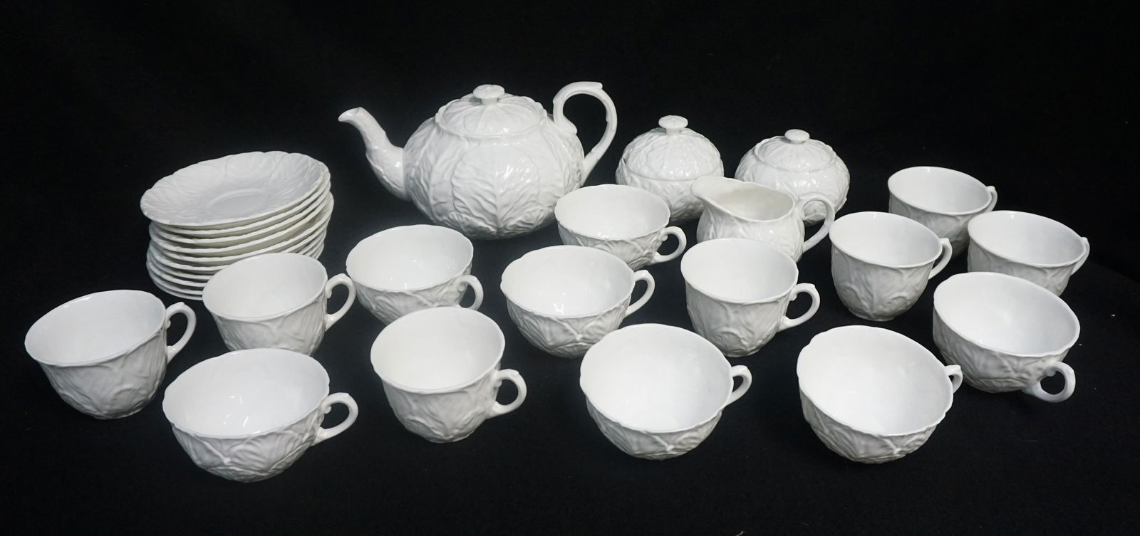 28 PIECE COALPORT COUNTRYWARE TEA SERVICE: 28 Piece Coalport Countryware White Tea Service. 1- Teapot and Lid 5". 2- Creamer & Sugar Bowl with Lid 3". 3- Marmalade and Lid 4". 4- 10 Saucers 5 1/2". 5- 8 Breakfast Cups. 6- 7 Teacups. Weight on