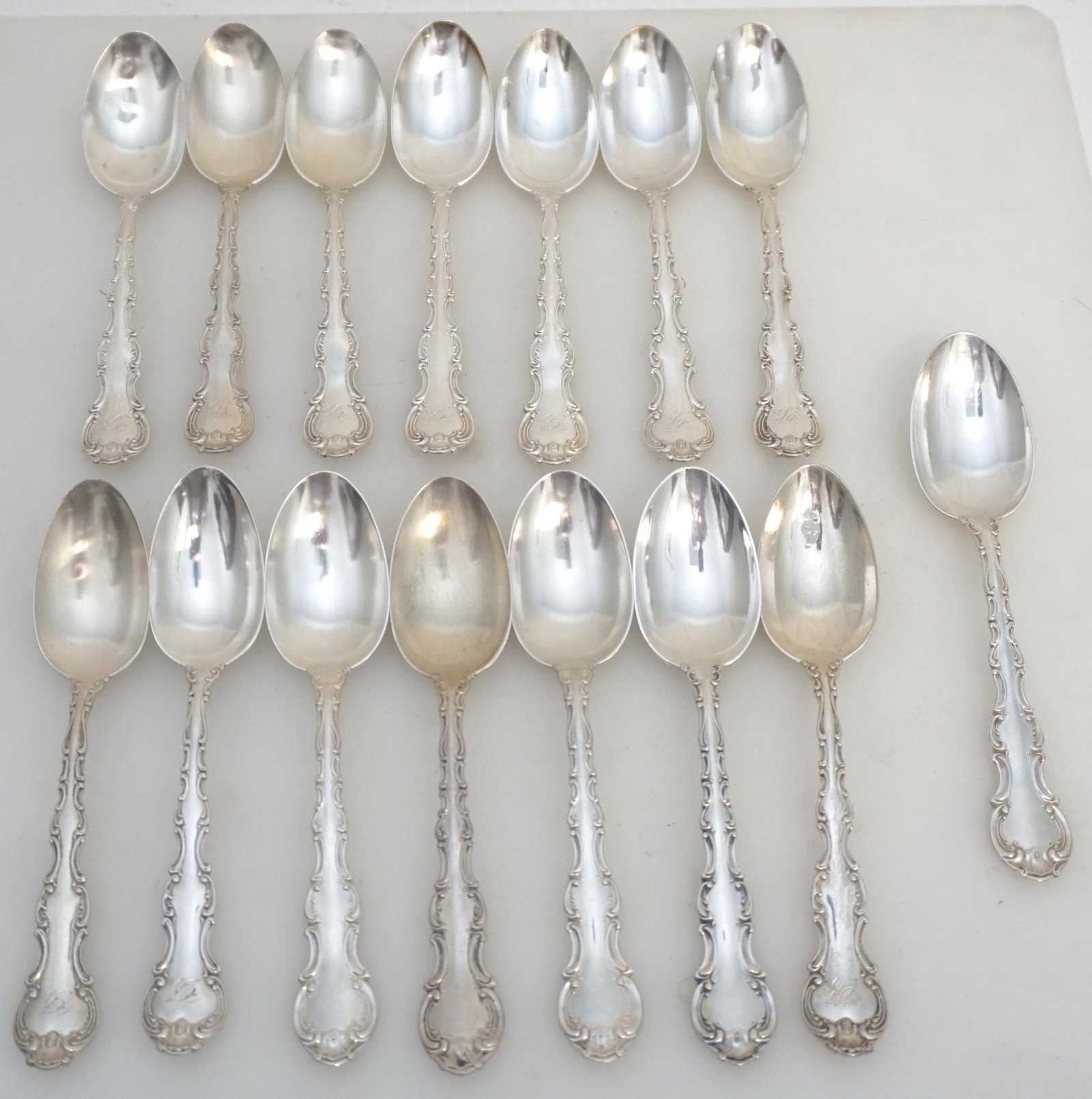 15 GORHAM STERLING STRASBOURG TEASPOONS: Fifteen (15) Gorham Sterling Silver Teaspoons in the Strasbourg Pattern. Each 5 7/8". 10 Monogrammed and 5 with no monograms. 3 of the monpgrammed bowls are bent. Approximate silver weight 435 grams. 