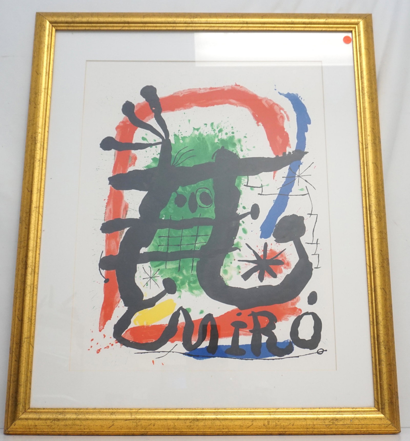 AFTER JOAN MIRO LITHOGRAPH IN COLORS: Lithograph After Jean Miro published by Leon Amiel in the 1980s. It is a fake by the master of lithographic forgers and quite well done. Professionally framed and matted, measures 29"x35"x2". Weight 1