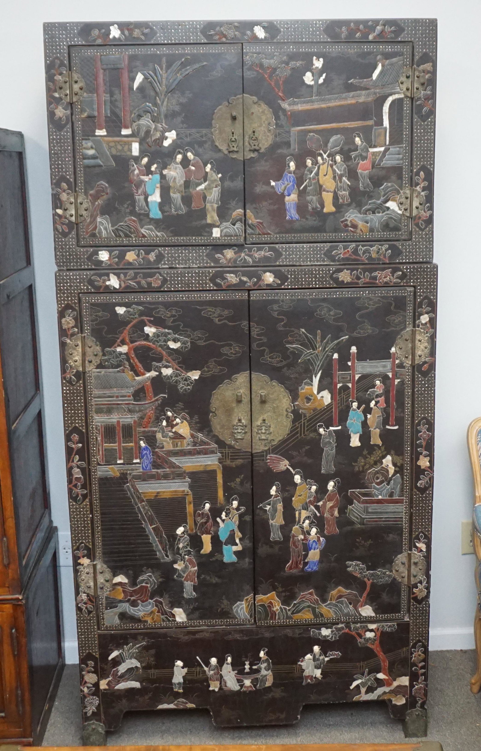 ANTIQUE JAPANESE INLAID 2 DOOR LACQUER CABINET: Antique Japanese 2 Part Inlaid Cabinet. Inlaid MOP and Hardstone. Red Laquer Interior. Together 80 1/2" Tall. Can be used seperately. Largest Piece 18 1/4"x39 1/2"x55 1/2". Smaller 18 1/4"x39 1/2"X25.