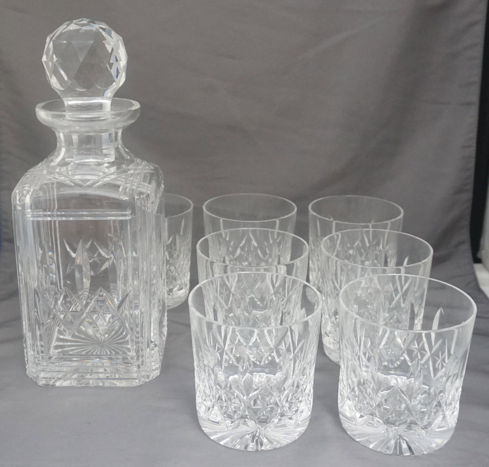 8 pc STUART CRYSTAL GLENCOE DECANTER & RUMMERS: Stuart Crystal Decanter & Glasses. In very good condition. 7 Large 3 3/8" Rummer Glasses 9 oz. Stuart Crystal "Glencoe" Square Decanter 10 1/4". Weight on all 12 pds 2 oz.
