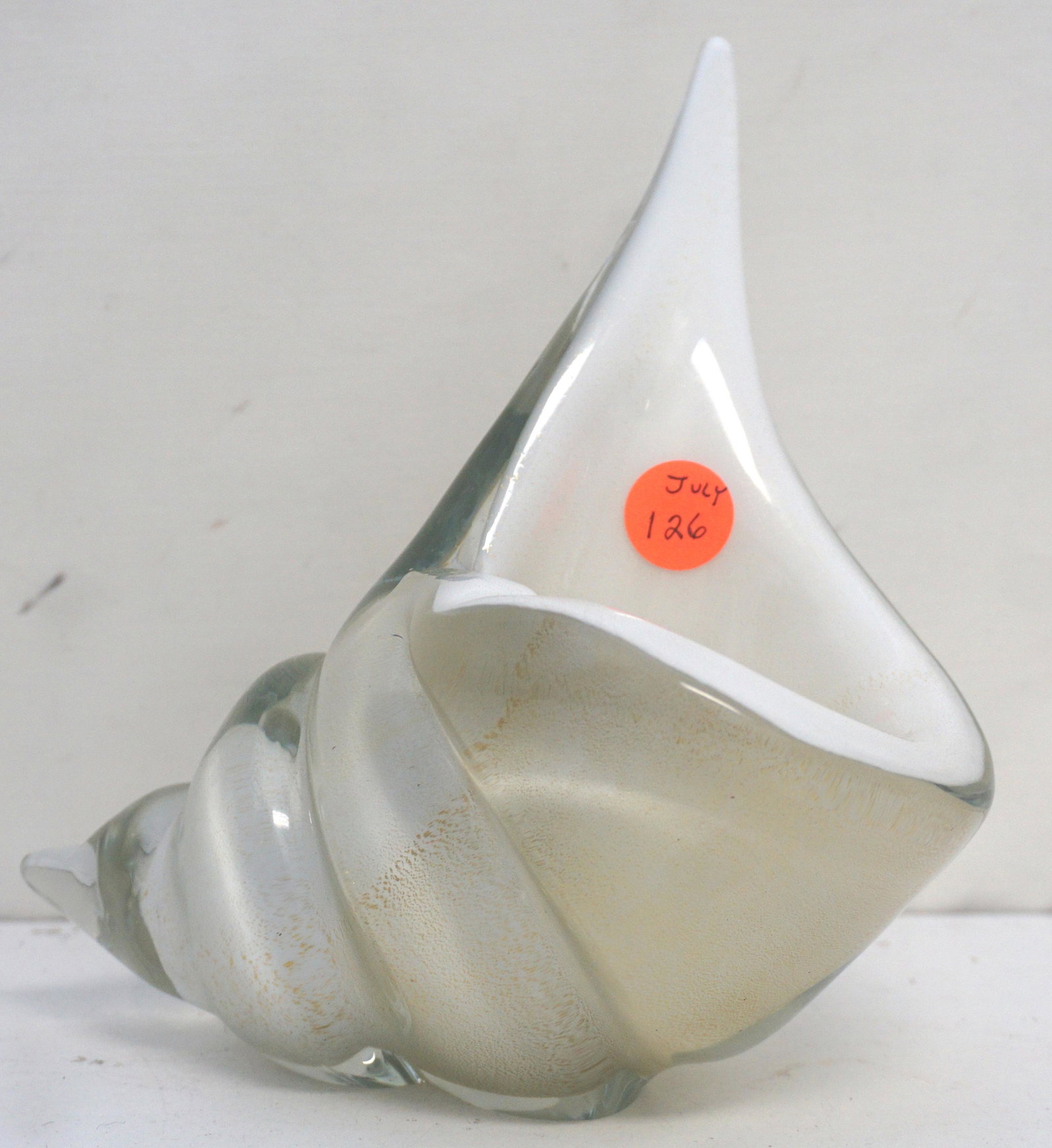 MID CENTURY MURANO ALFREDO BARBINI CONCH SHELL: Murano Glass Conch Shell Bowl Attributed to Alfredo Barbini, c. 1950s. White and Gold aventurine, good condition. Measures 6 3/4" h, 6" w, 5" d. Weight 2 pds 11 oz. PROVENANCE: A Charleston SC Private