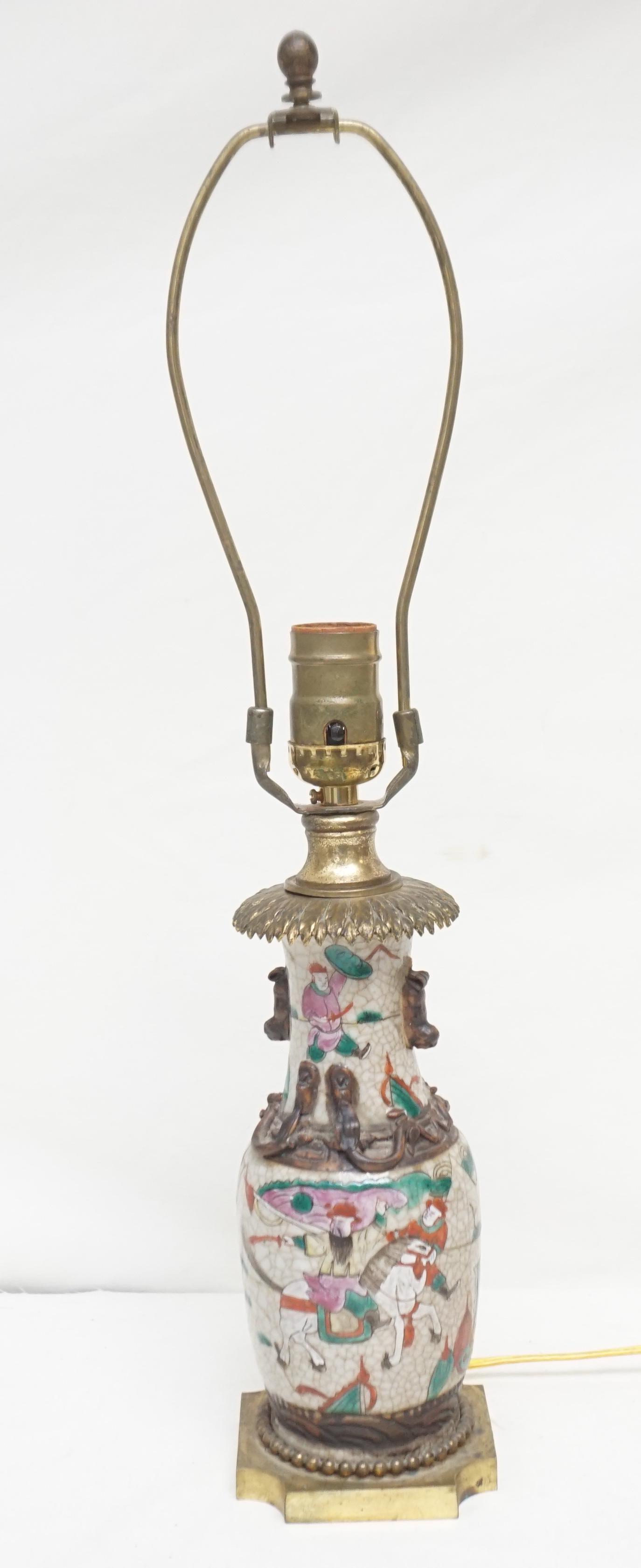 ANTIQUE CHINESE PORCELAIN CRACKLE VASE/LAM: Antique Chinese Porcelain Crackle Vase mounted as a Lamp Hand Painted Warriers with Foo and Dragon Accents. Measures 12 1/2" tall. Weight 3 pds. PROVENANCE:The Johnston-Buist Family of Charleston.