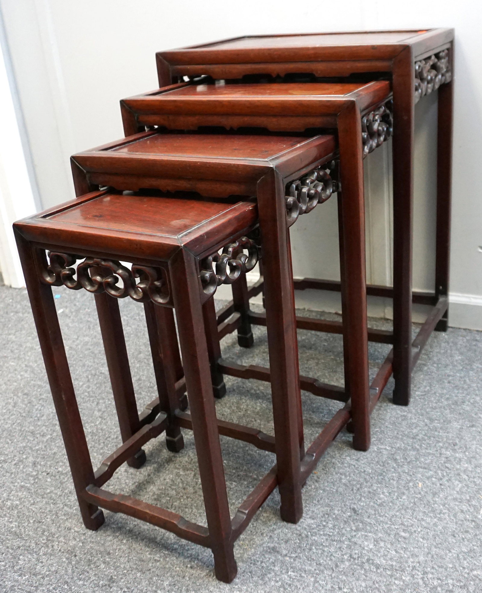 SET OF 4 CHINESE ROSEWOOD STACKING TABLES: Set of 4 Vintage 1930s Chinese Rosewood Stacking Tables. Damage to fretwork on one. Largest 19"x13 1/2"x27". NO IN HOUSE SHIPPING***Pickup only or Shipping on this item offered through Pak Mail 843-84