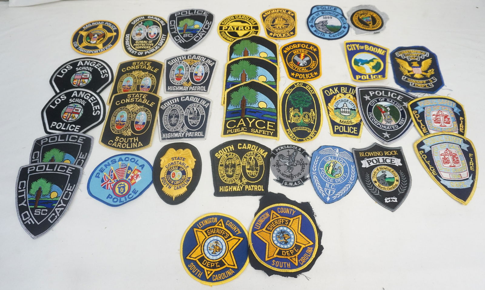 LARGE GROUPING AMERICAN POLICE BADGES: Large Grouping of American Police Badges. SC State Constable SLED, Chesterfield County Sheriff, Cayce Public Safety, Town of Blowing Rock NC, City of Boone NC and many more. See photos. Weight on all
