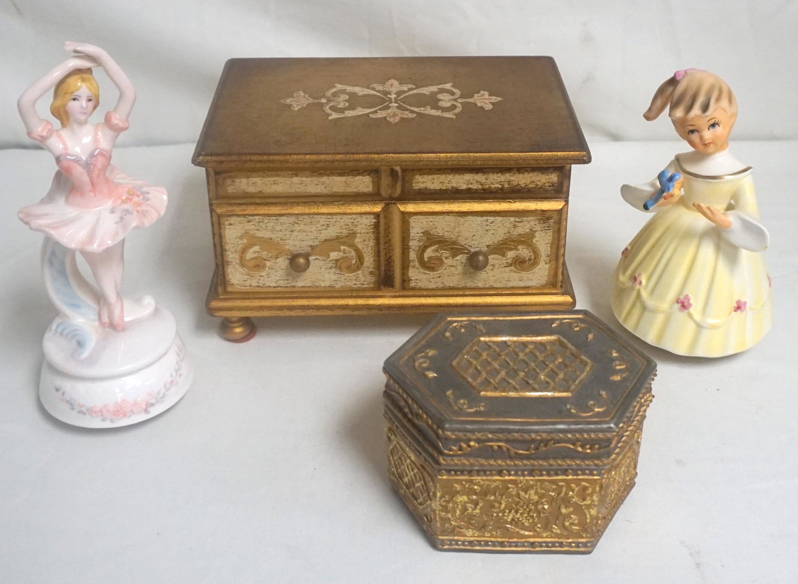4 VINTAGE MUSIC BOXES / JEWELRY BOXES: Four Vintage Music Boxes, all working. 1- Florentine Style Jewelry Music Box 8 1/2". 2- San Francisco Music Box Company Trinket Box 4 3/4". 3- Schmid Girl with Bluebird 6 1/2", nick to tip of bird win