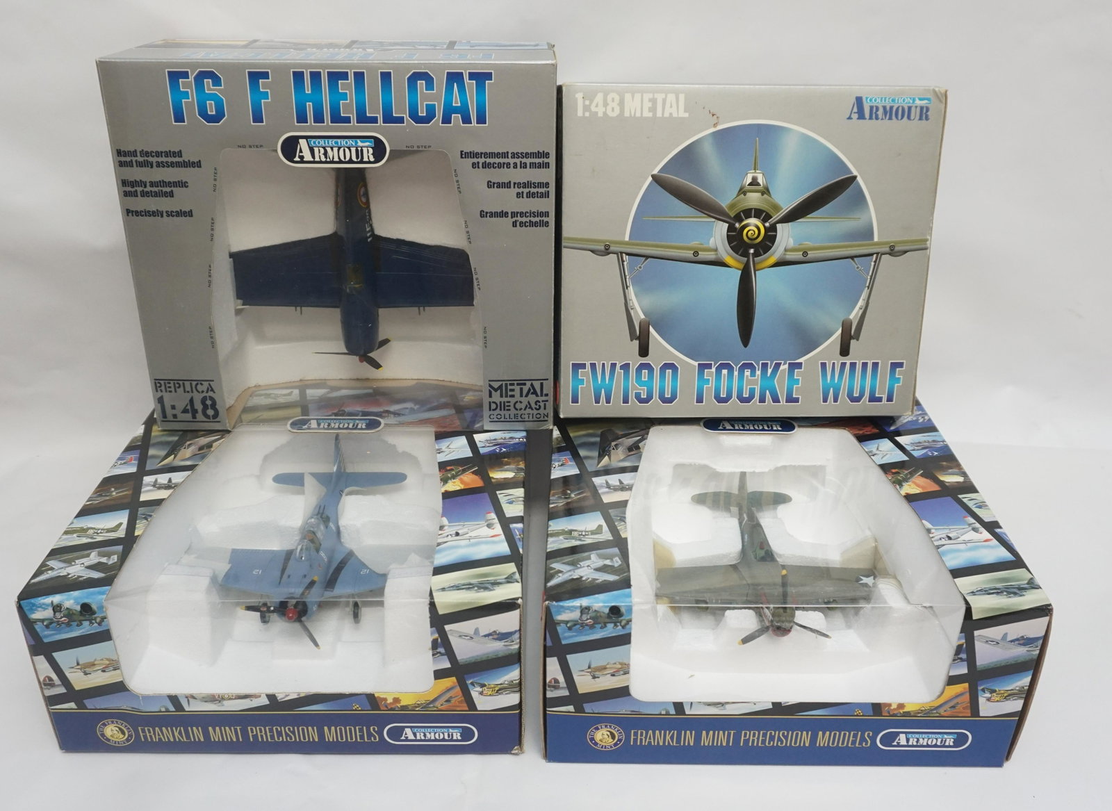4 FRANKLIN MINT ARMOUR COLLECTION 1:48 SCALE MODEL: Four Franklin Mint Armour Collection 1:48 scale model planes in original boxes. Includes: 1.) Franklin Mint Precision DB 1 Dauntless model B11B937 2.) P40E Warhawk model B11619 3.) FW 190 Luftwaffe "I
