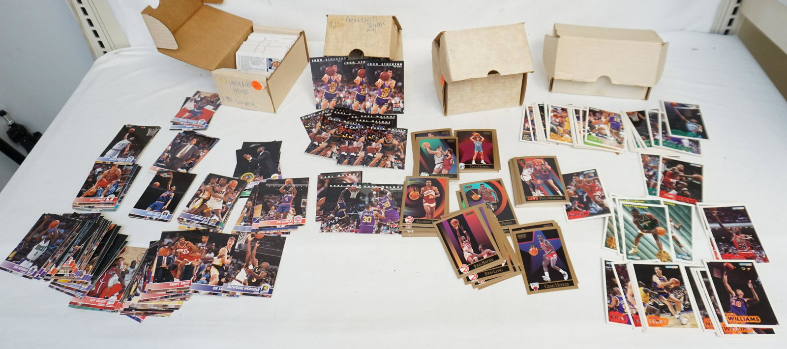 1984-1993 BASKETBALL CARD SETS ( SKYBOX, FLEER & NBA: Lot of 4 sets of NBA cards. Includes: 1.) 1984 NBA Hoops 300 card set. 2.)1990 Skybox series 2 set 3.) 1993 Fleer series 1 set. Cards not checked for accuracy. Total weight 5 lbs. Inhouse shipping not