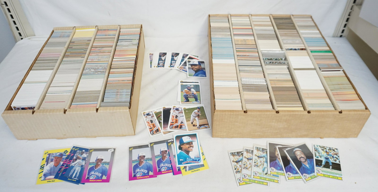 LARGE LOT OF VINTAGE BLUE JAYS BASEBALL CARDS: Two large boxes of Blue Jays baseball star player cards. New Old Stock of Topps, Fleer, Upper Deck & More 1970-1990's cards, includes duplicates. Total weight 36 lbs. Inhouse shipping not guaranteed o