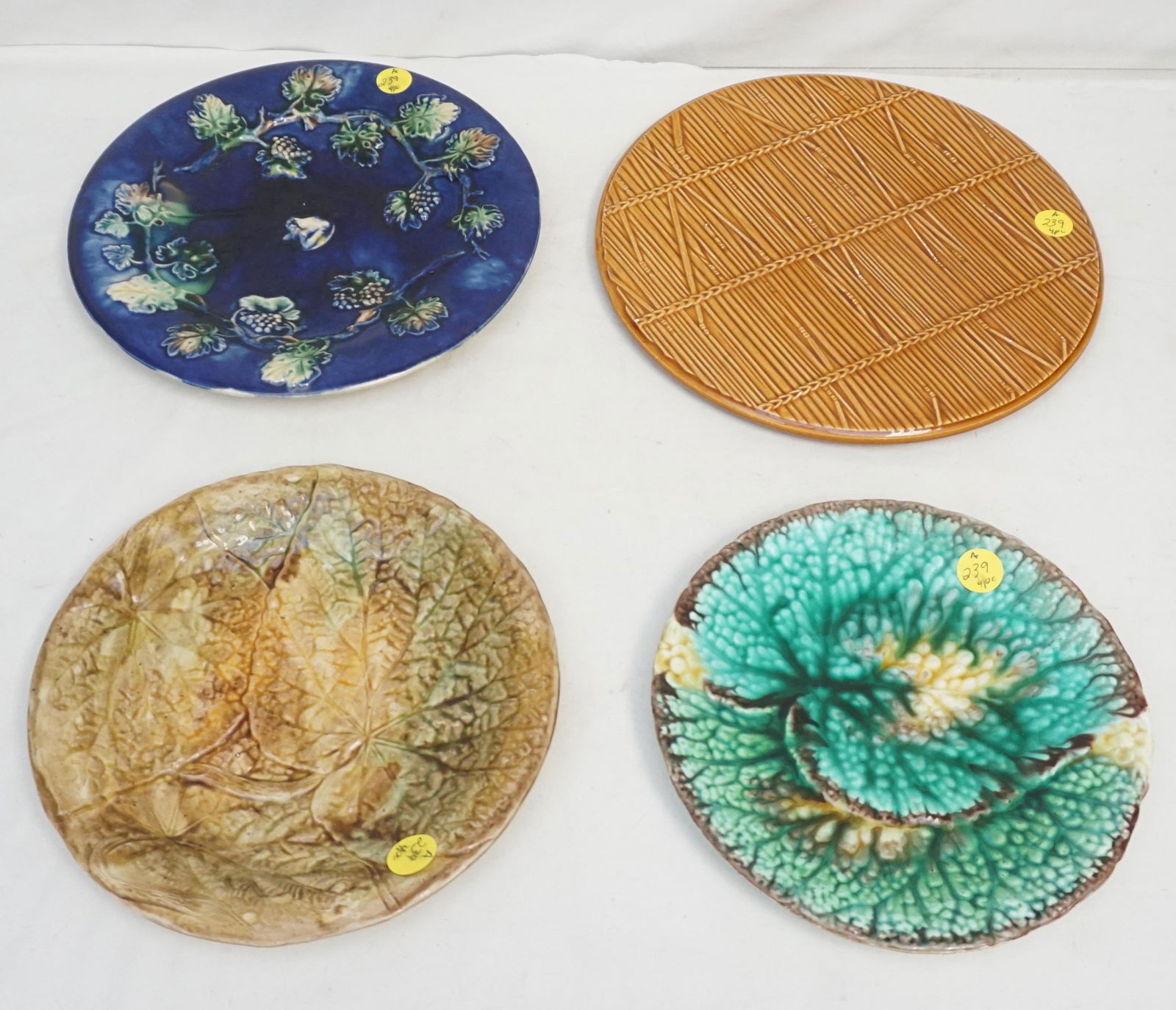4 pc ANTIQUE / VINTAGE MAJOLICA: Gien France Hot Plate / Trivet 10". 3 Antique Majolica Plates 7 3/4", 8 1/4" and 9 1/4". Largest blue has 2 chips to back. Weight on all 4 pds 8 oz. PROVENANCE: A Private Charleston SC Estate