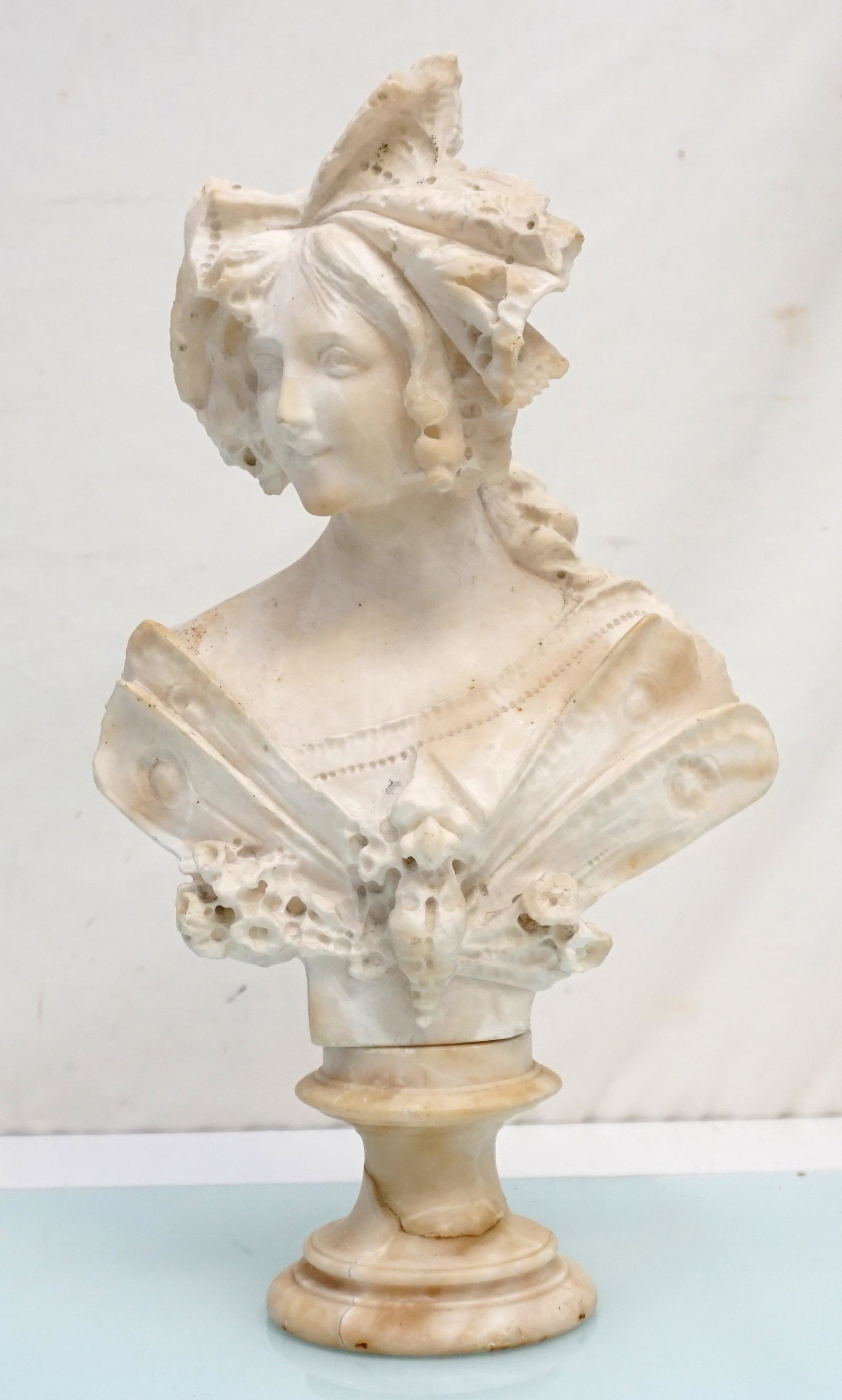 ITALIAN ALABASTER BUST OF A LADY: An Italian Alabaster Sculpture Bust of a Lady. Late 19th/Early 20th Century. Pedestal has been glued - see all photos. Height 16". Approximate weight 14 pds. NO IN HOUSE SHIPPING. PROVENANCE: A Privat