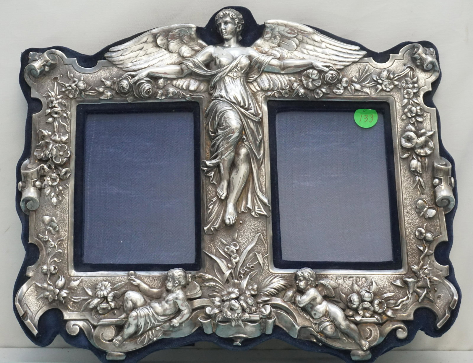 STERLING DOUBLE FRAME ANGEL: Antique Charles Hougham English Sterling Silver Highly Ornate Neo-Classical Georgian Period Double Picture Frame. Excellent detail throughout, depicting a winged angel, surrounded by scrolls and flora