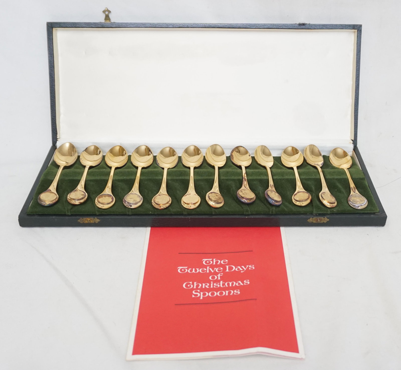 VERMEIL OVER STERLING CHRISTMAS SPOONS 12: Twelve Days of Christmas Franklin Mint 24k Vermeil over Sterling designed by Carlos Sierra Franco Spoons Set. In the Original presentation box. In Box 16"x6 1/2"X1 1/2". Weight in box 2 pds 6 oz. PROV