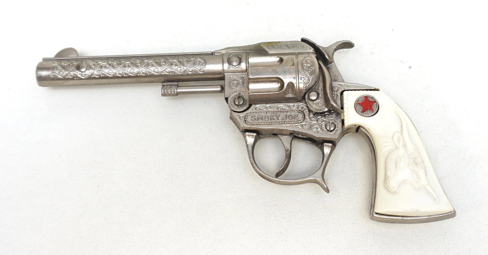 VINTAGE SMOKEY JOE TOY GUN: Vintage 1950s Smokey Joe Texas Longhorn Grip Toy Gun 8". Weight 8 oz