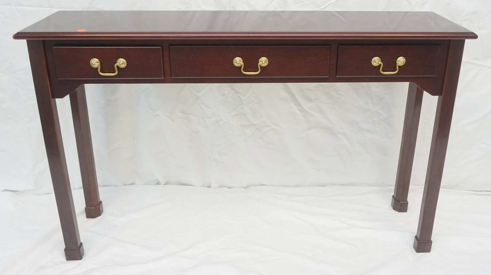 MAHOGANY CONSOLE TABLE: Three Drawer Mahogany Console Table. Measures 48"x12"x30" Shipping on this item offered through, Pak Mail 843-849-0310 - info@charlestonshipping.com or Quik Mail Etc 843-723-6598 quikmailetc@gmail.com