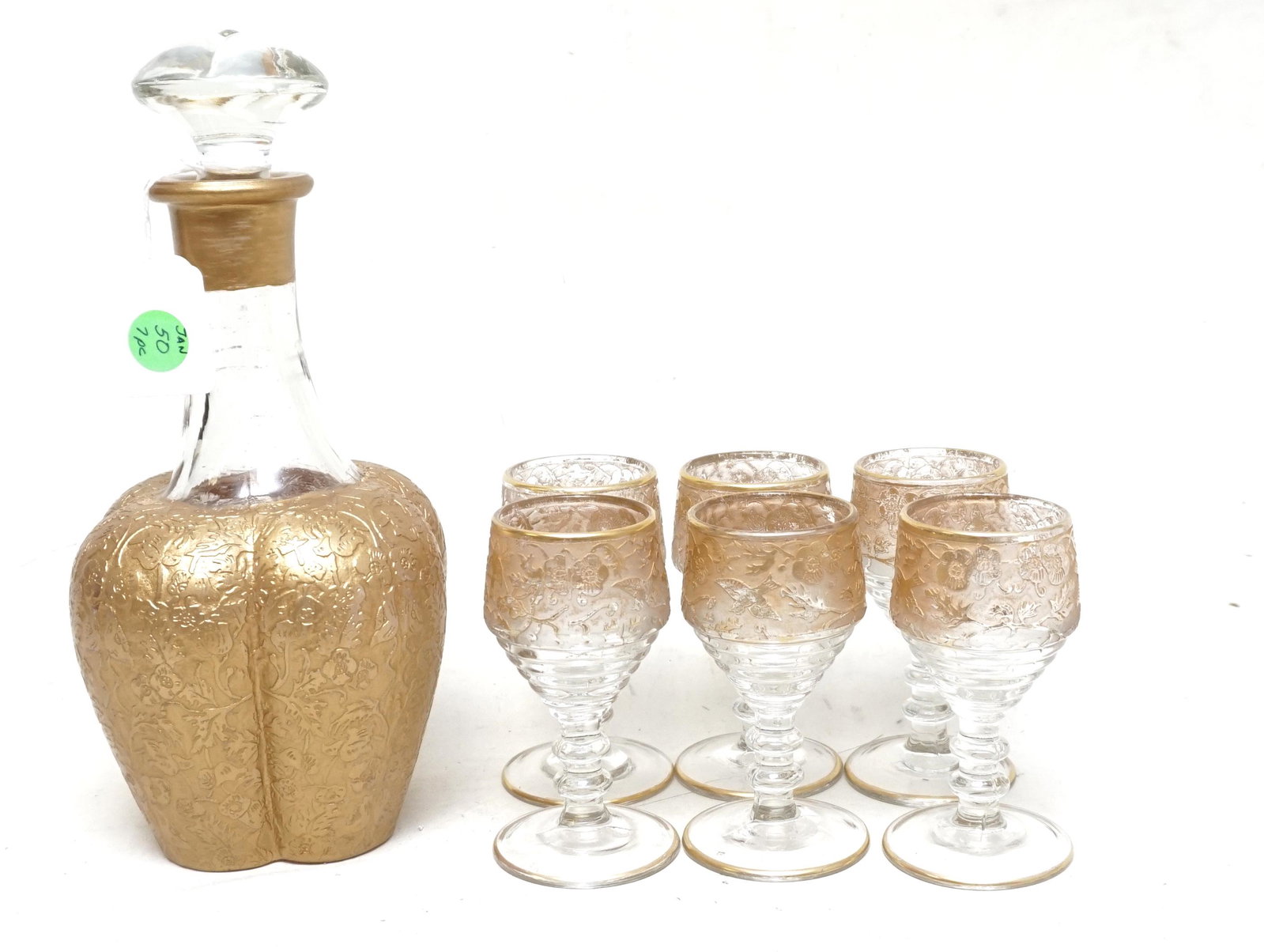 PADEN CITY SPRING ORCHARD LIQUOR SET: Rare, hard to find complete set, gold encrusted decanter and 6 glasses made by Paden City in their Spring Orchard Gold pattern. The 4 lobbed decanter is 10 3/4" high to the top of the stopper and 4 1/