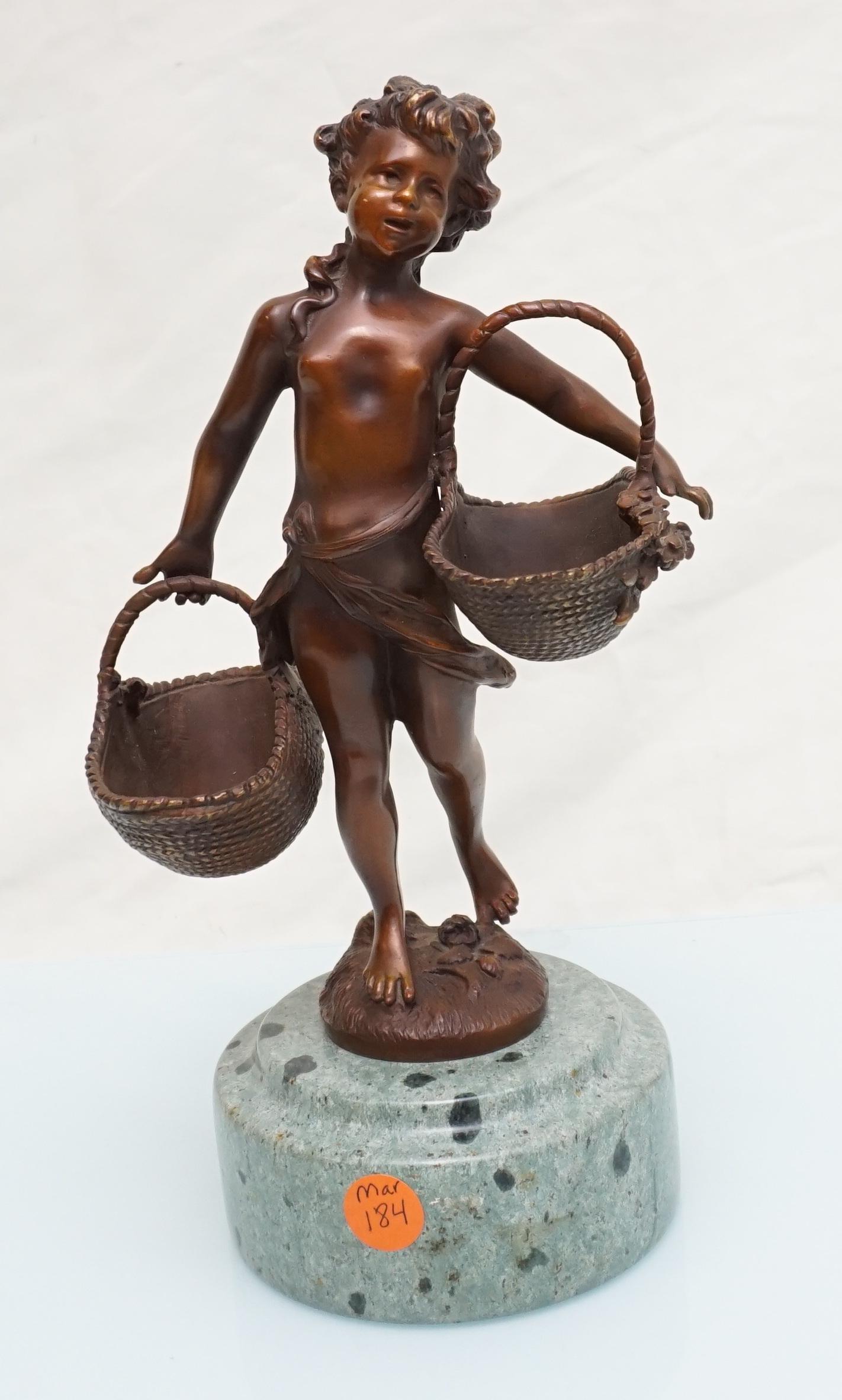 BIZARD BRONZE GIRL WITH BASKETS ON MARBLE BASE: A bronze sculpture after Suzanne Bizard's "Kind mit zwei KÃ¶rben". Features a bronze nude, Neoclassical girl wielding two woven wicker baskets in her hands. Finished in a soft brown patina and fitte