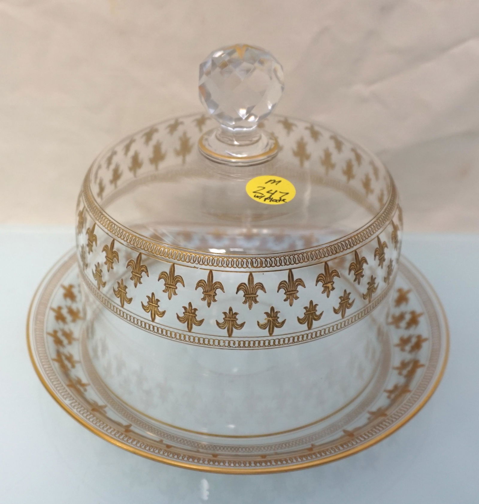 BOHEMIAN ENAMELED FLEUR DE LIS CHEESE / BUTTER DOME: Antique Crystal Bohemian Fleur de Lis Cheese or Butter Dome. Enameled gold Fleur de Lis. Underplate with polished pontil. Plate 7 3/4". Dome 5 1/2"x5 1/2"x6". Weight combined 1 pd 13 oz. PROVENANCE: A