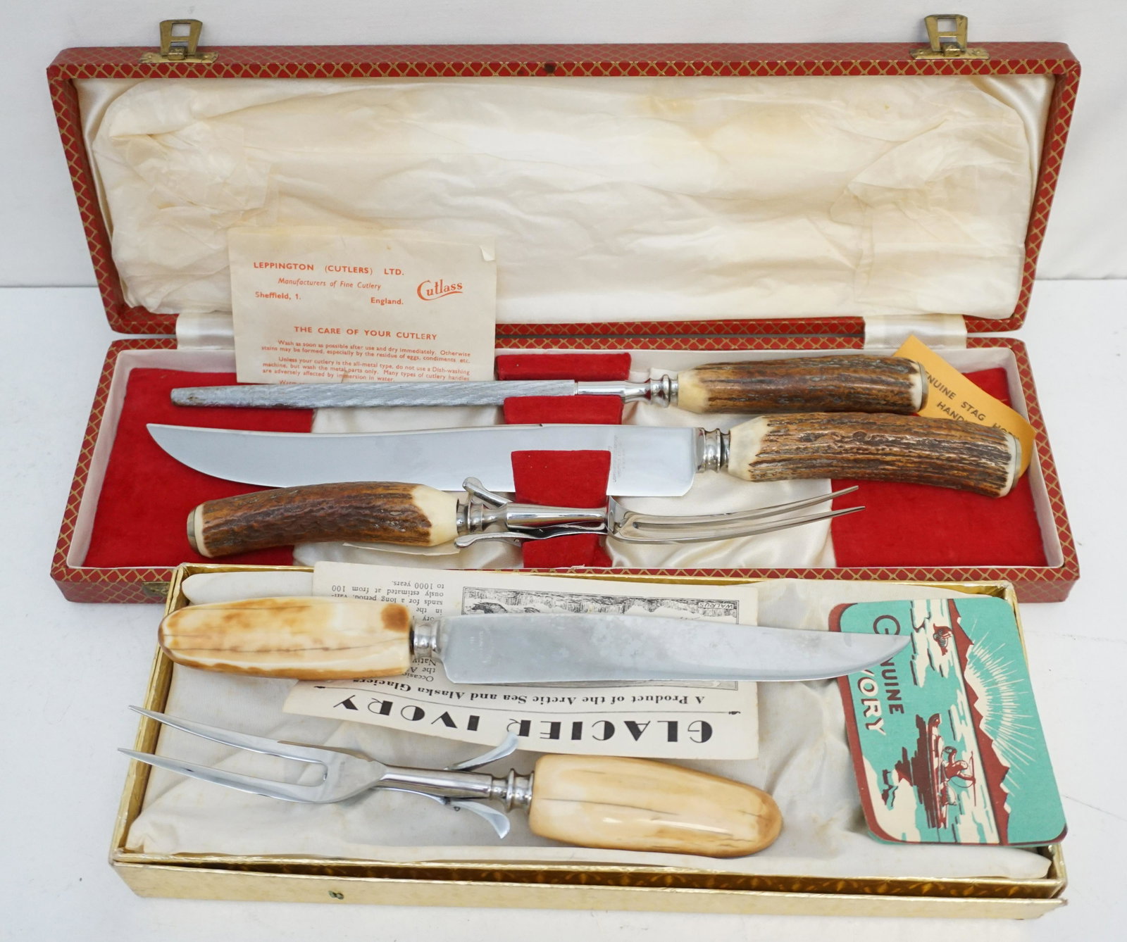 2 VINTAGE STAG HORN & WALRUS TUSK CARVING SETS: 1 -Carved and Polished Eskimo Inuit Walrus Tusk Ivory 2 Piece Carving Set in the original box. Knife is 10 1/2". 2- Cutlass Sheffield 3 Piece Carving Set with Stag Horn Handles. Knife is 14". Weight o