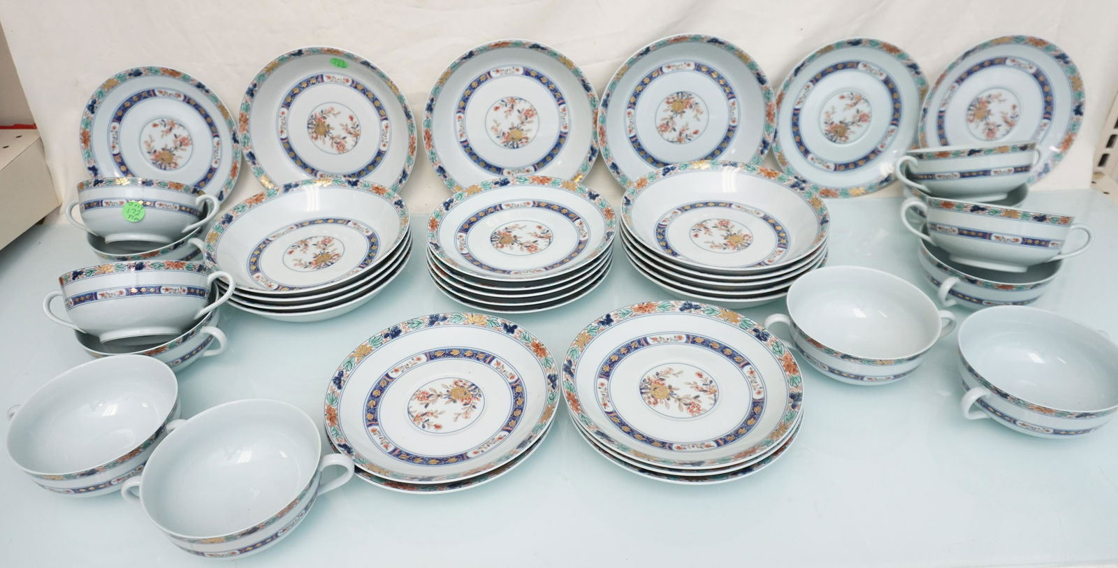 37 PC RAYNAUD LIMOGES KOUTANI (CELADON) CREAM SOUPS & COUPE SOUPS: 37 Piece Scarce and Hard to Find Raynaud Limoges France "Koutani" (Celadon Background) Cream Soups, Saucers and Soup Bowls. 12 Footed Cream Soup Bowls 4 1/2". 13 Saucers for Cream Soups 7 1/8". 12 Cou