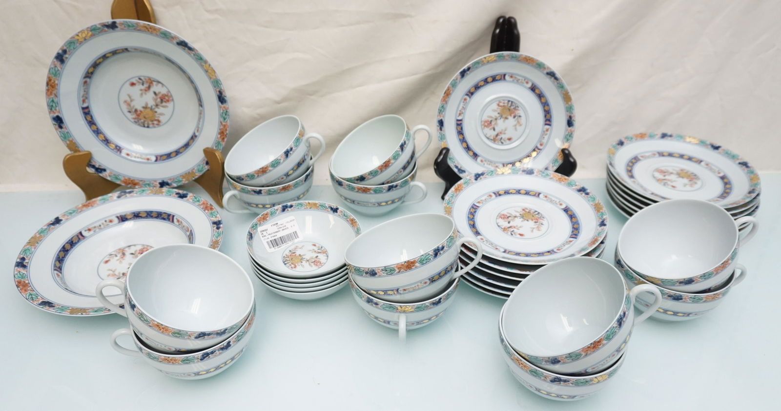 32 PC RAYNAUD LIMOGES KOUTANI (CELADON) CHINA: 32 Piece Scarce and Hard to Find Raynaud Limoges France "Koutani" (Celadon Background) Fine China. 13 Saucers 7". 12 Oversized Tea Cups 2 3/4" high and 4" wide. 2 Rim Soup Bowls 9". 5 Fruit / Dessert