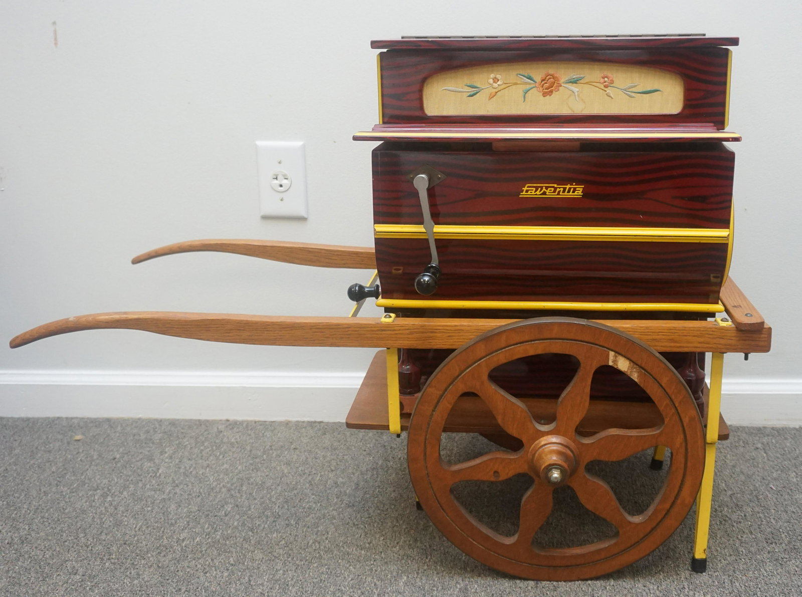VINTAGE SPANISH HURDY GURDY BARCELONA: Vintage Spanish Vicente Llinares Barcelona, Spain Hurdy Gurdy windup organ with cart. The organ works. Good Condition. The hand crank on the side of the case would change between tunes and the crank o