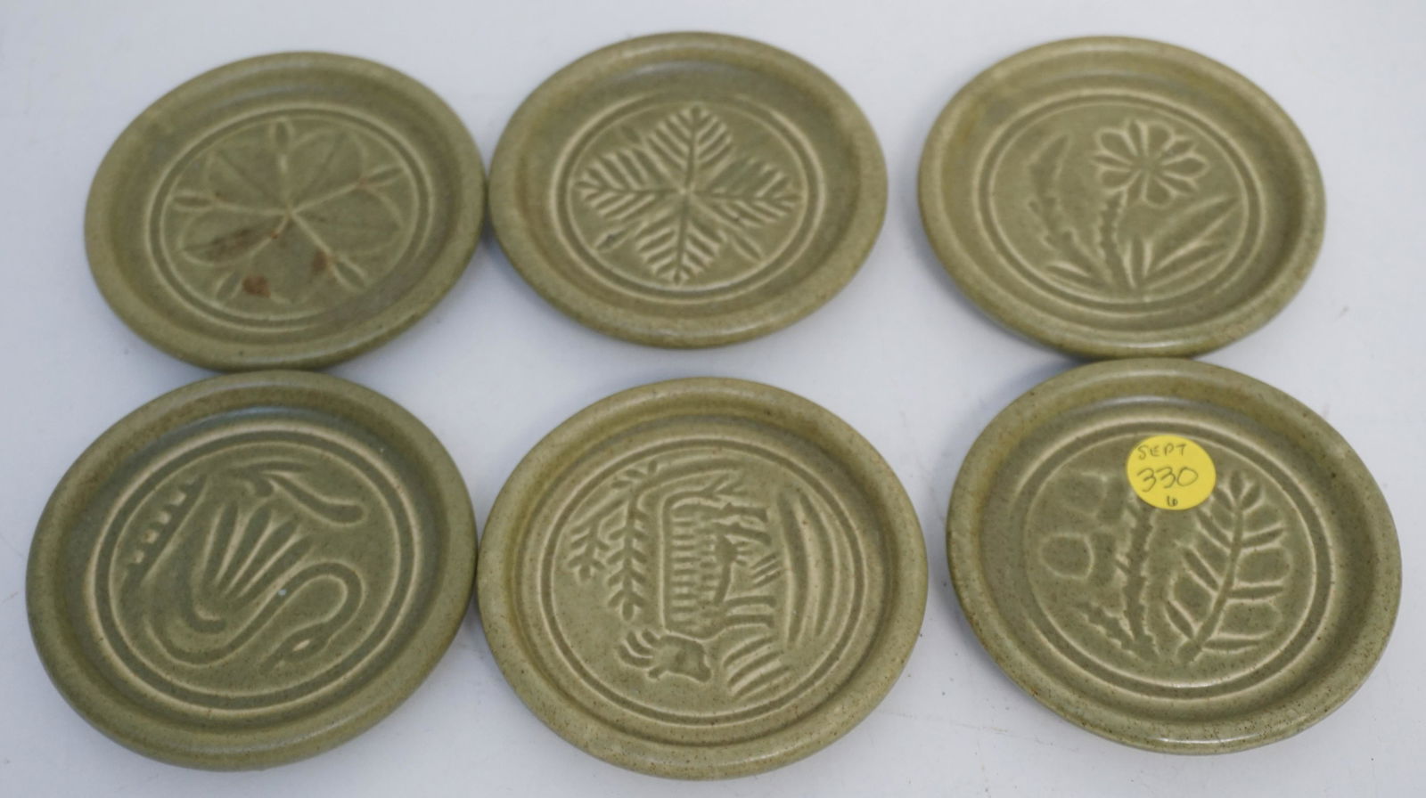 6 PIGEON FORGE POTTERY COASTERS: 6 Vintage Pigeon Forge Pottery Coasters. Each 3 3/4". Weight 1 pd 11 oz. PROVENANCE: 25 East Battery, Charleston SC. The Charles H. Drayton House, built between 1883-1886. Cited by architectural histo