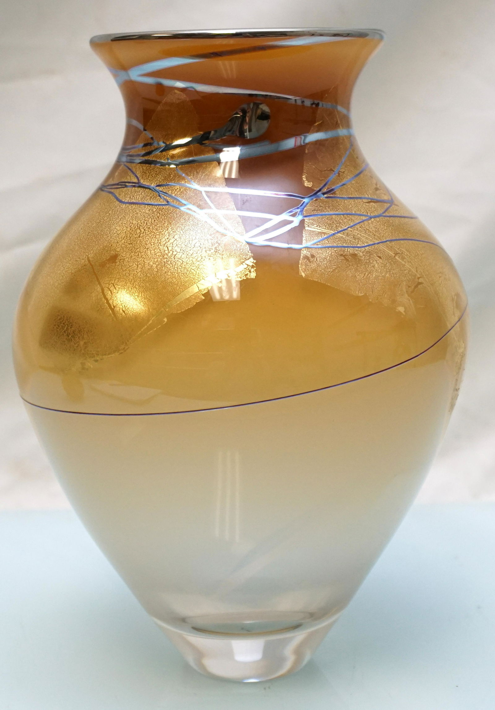 MICHELLE KAPTUR SIGNED ART GLASS VASE: Michelle Kaptur Blown Art Glass Vase from her series "Summer Gold" featuring gold leaf and bold black lines over a glowing golden base. The piece measures 9 1/2" high with etched â€˜Kapturâ€™