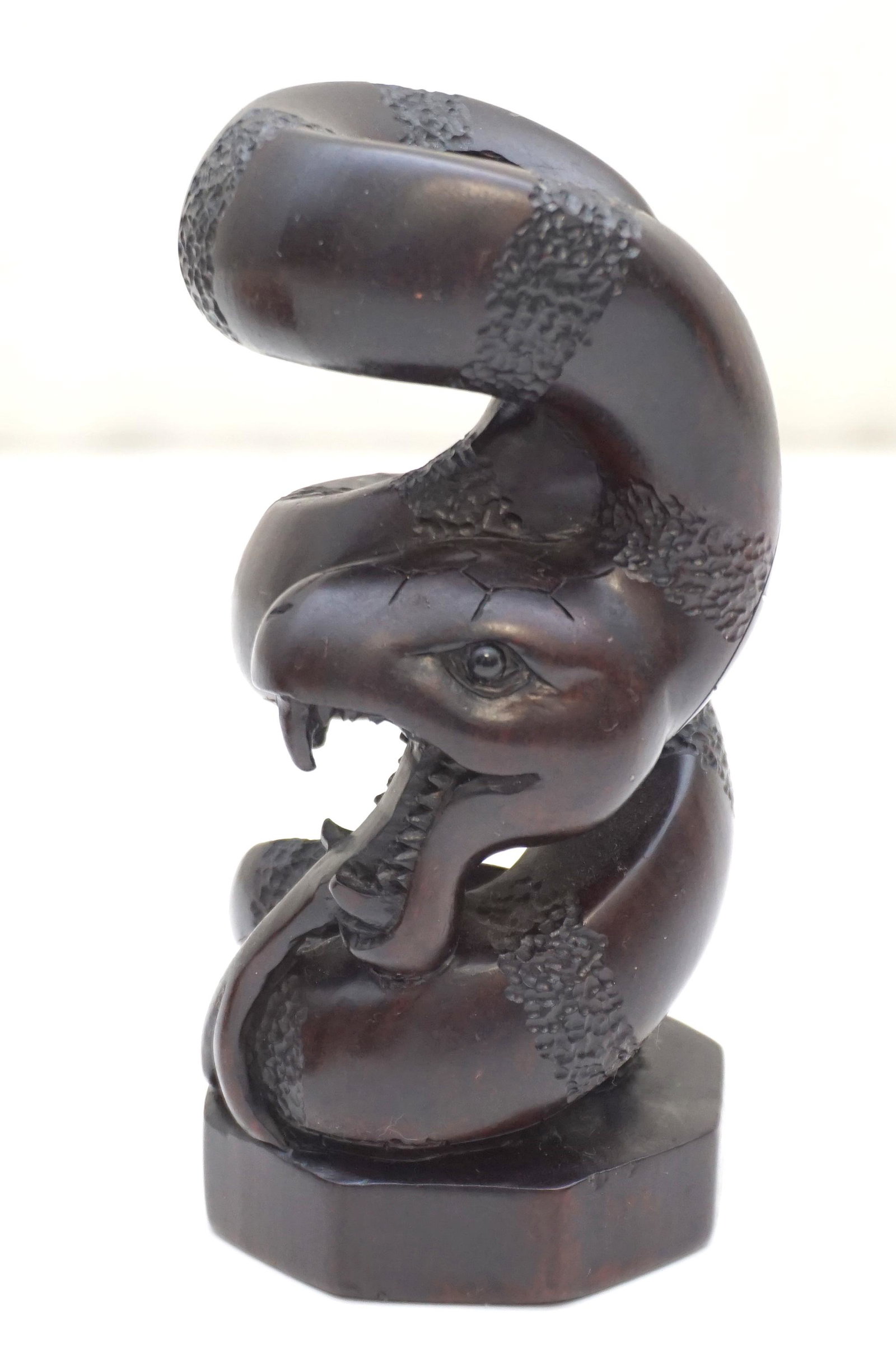 JAPANESE HAND CARVED SNAKE: Japanese Hand Carved Snake. Carved from a solid piece of Wood. Measures 3 3/4'. Weight 4.4 oz. PROVENANCE: A Private Charleston SC Estate.