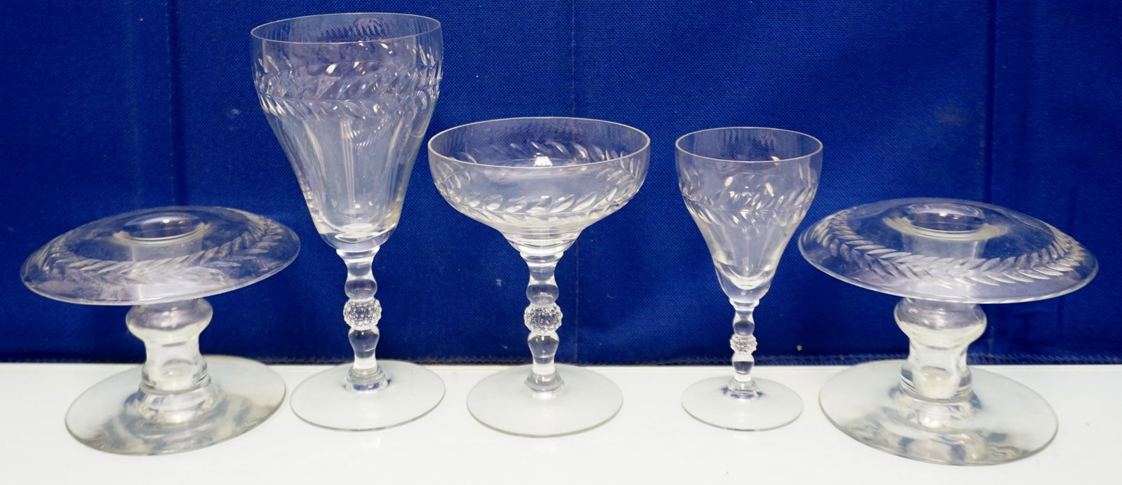 31 PC DUNCAN & MILLER LAUREL LEAF CRYSTAL: 31 Piece Vintage 1940s Laurel Leaf Crystal Glassware by Duncan & Miller. 8 Iced Teas 6 3/8". 6 Champagnes Tall Sherbets 4 7/8". 8 Water Goblets 6 3/4". 2 Claret Wine 5 1/2". 5 Wine Glasses 5 7/8". 2 C