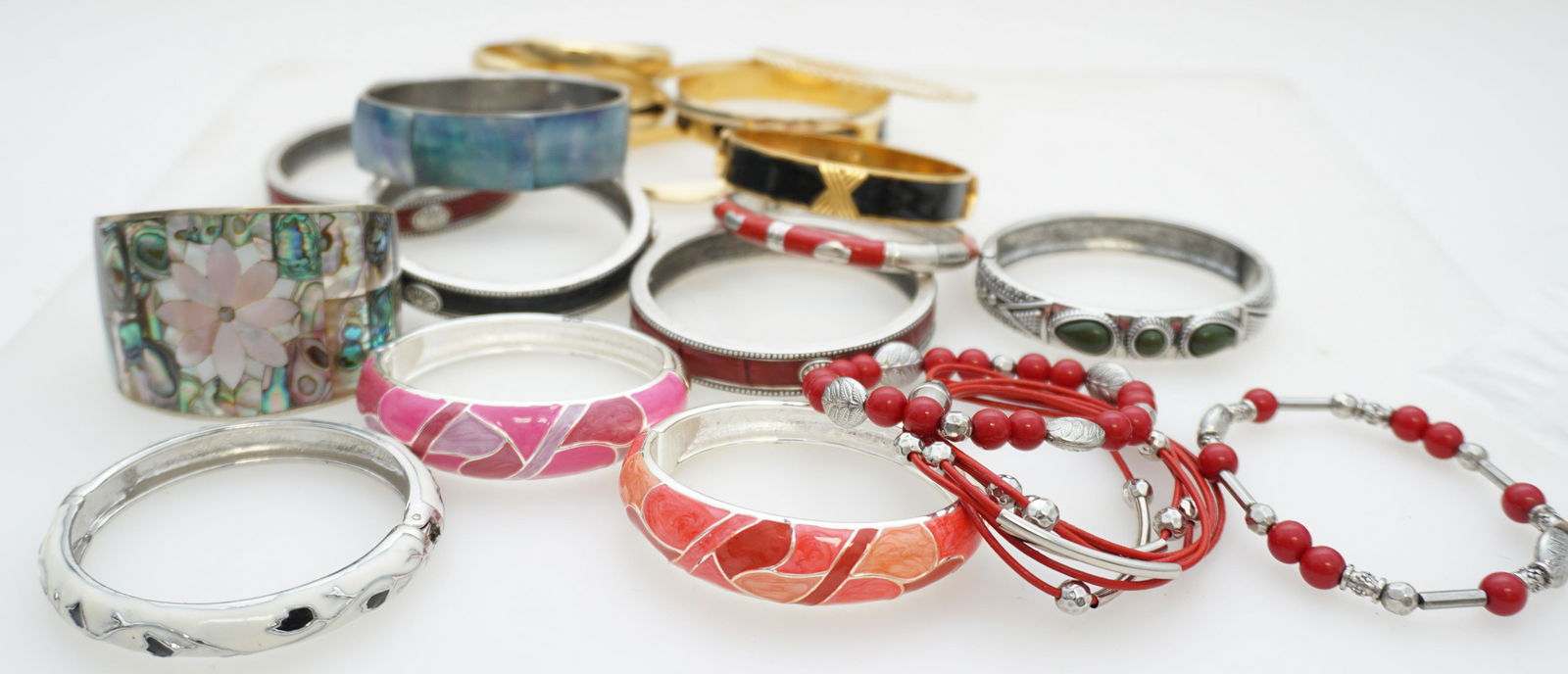 20 PC VINTAGE COSTUME BRACELETS: 20 Pc Vintage Costume Bracelets. Includes Enameled, Large MOP/Abalone. 2 by Monet. Weight on all combined 1 pd 5 oz. PROVENANCE: A Private Charleston SC Estate