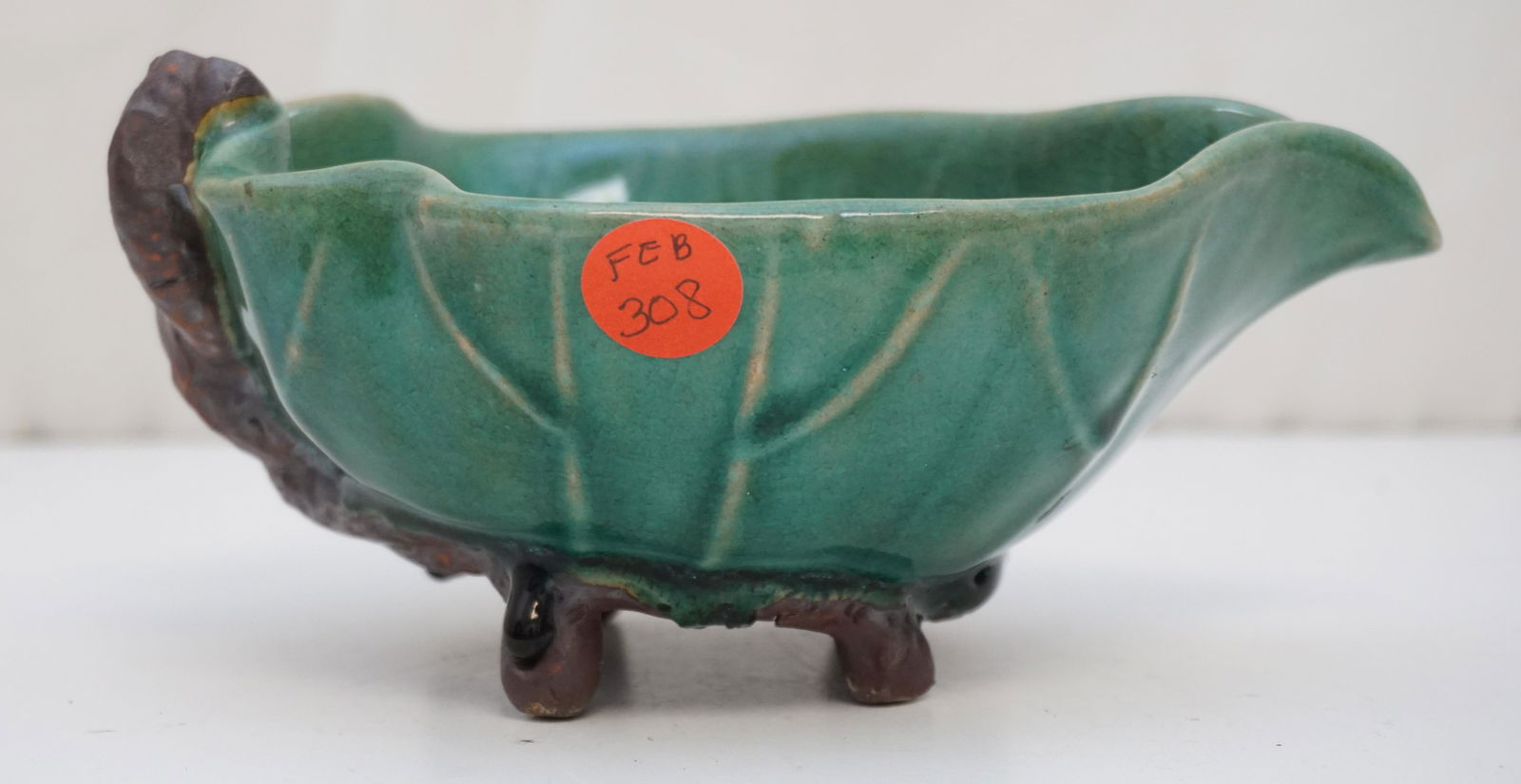 VINTAGE CHINESE POTTERY SAUCE BOAT: Vintage Chinese Glazed Green Figural Leaf Sauce Boat. Signed. Measures 7"x5"x3 1/2". Weight 1 pd 6 oz,. PROVENANCE: A Private Charleston SC Estate.