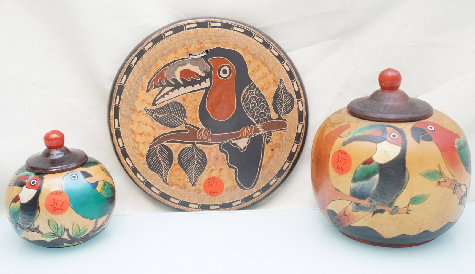 3 PC VINTAGE TOUCAN WOOD + TERRACOTTA: 2 Vintage Turned, Carved and Painted Wood Bowls with Lids, Tropical Birds 5 3/4" and 4". Terracotta Toucan Trivet 7 1/2". Weight on all combined 1 pd 13 oz. PROVENANCE: A Private Charleston SC Estate.