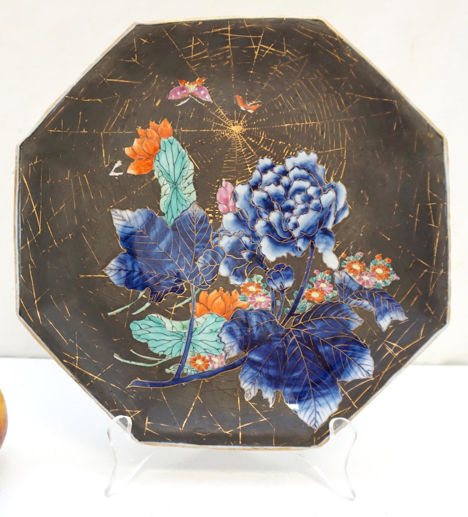 ANTIQUE JAPANESE ENAMELED SPIDER WEB MUMS PLATE: Late 19th, early 20th c. Japanese Octogonal Enameled Chrysanthemum Plate. Matte Brown with Gold Spider Web and Enameled chrysanthemum and butterfly decoration Measures 10"x10"x1 1/4". Weight 1 pd. PRO