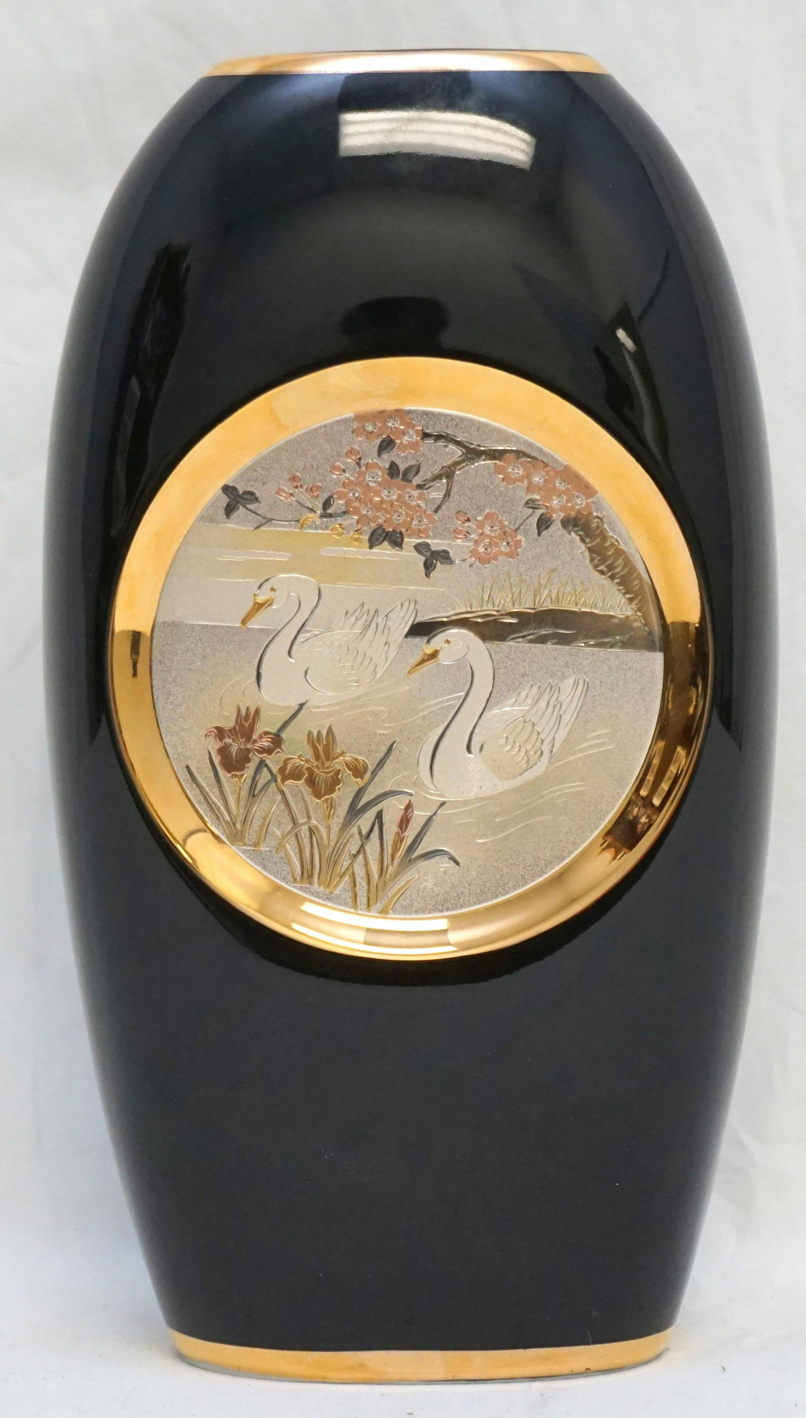 JAPANESE CHOKIN PORCELAIN VASE 22K W SWANS: The Art of Chokin Japan. Porcelain Vase with Silver Swans trimmed in 24k gold. 5"x10". Weight 2 pds 2 oz.
