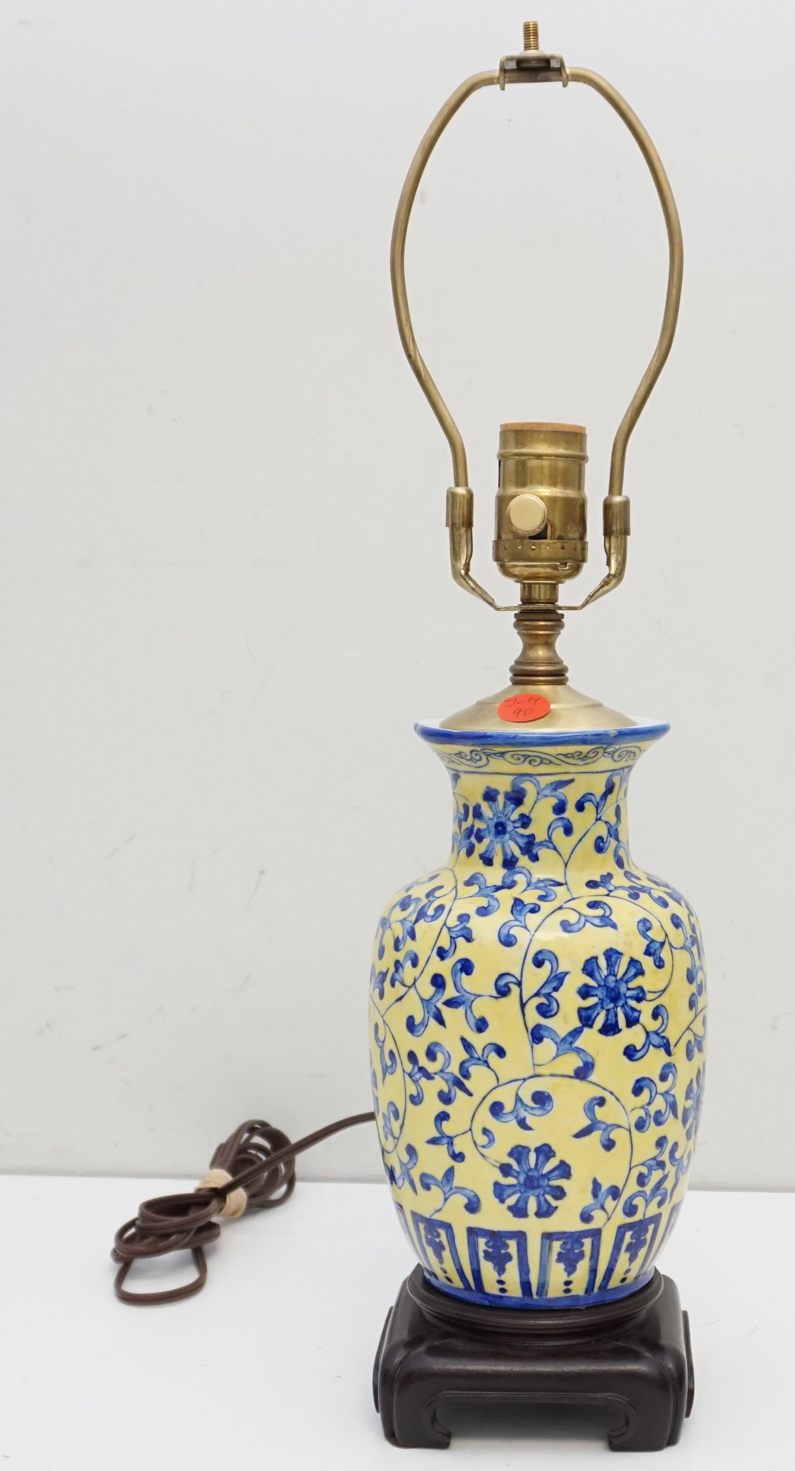 VINTAGE CHINESE PORCELAIN VASE MOUNTED AS LAMP: Early 20th c Chinese Porcelain Vase mounted as a lamp. Blue floral design on yellow ground. Measures 15.25" without harp. Weight 3 pds 12 oz. PROVENANCE: A Charleston Private Estate.