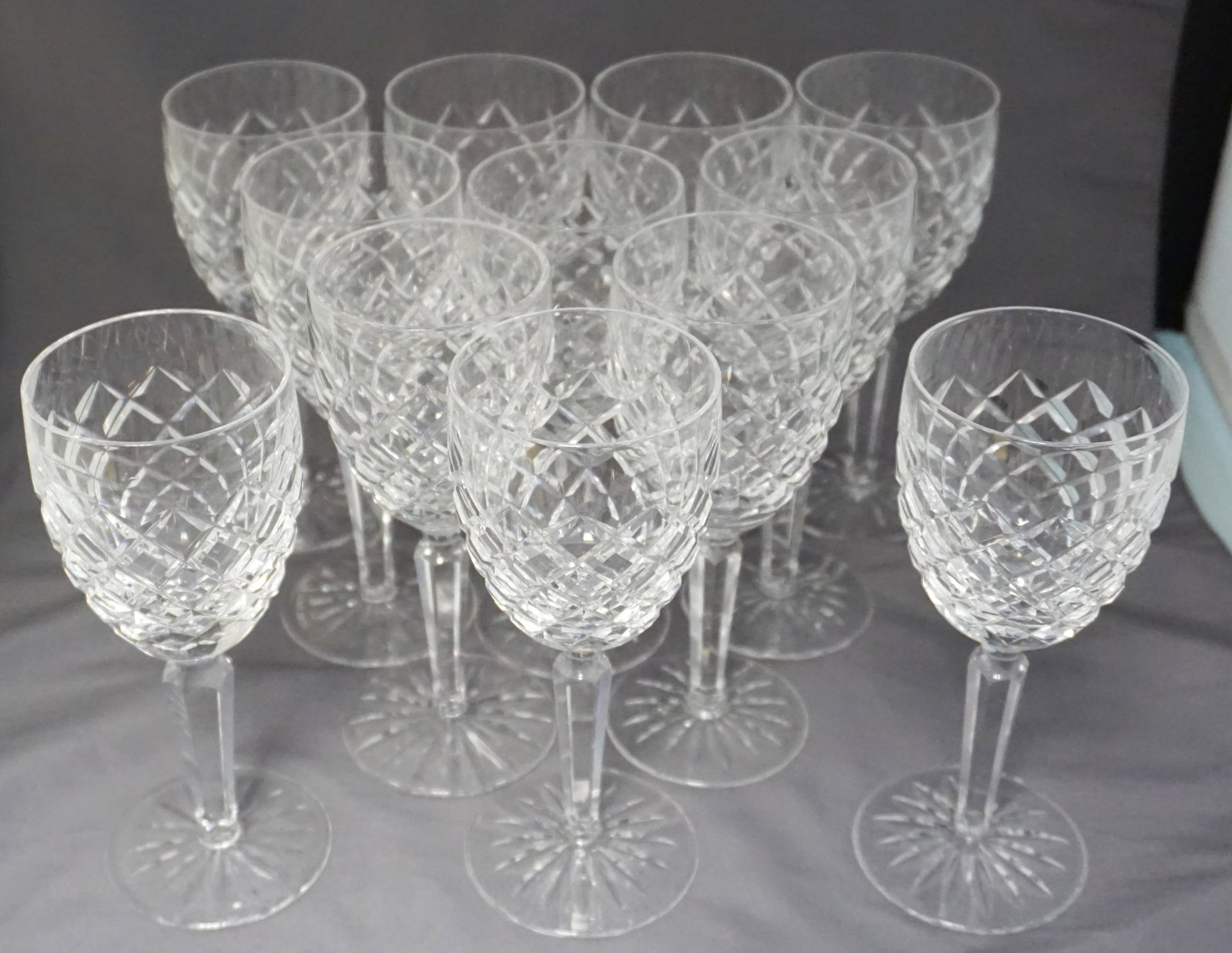 12 WATERFORD CRYSTAL COMERAGH CLARET WINE GLASSES: 12 Vintage Waterford Crystal "Comeragh" Claret Wine Glasses. Clear, Cut Bowl, Cut Foot Each 6 5/8". Weight on all 8 pds. PROVENANCE: A Charleston Private Estate.