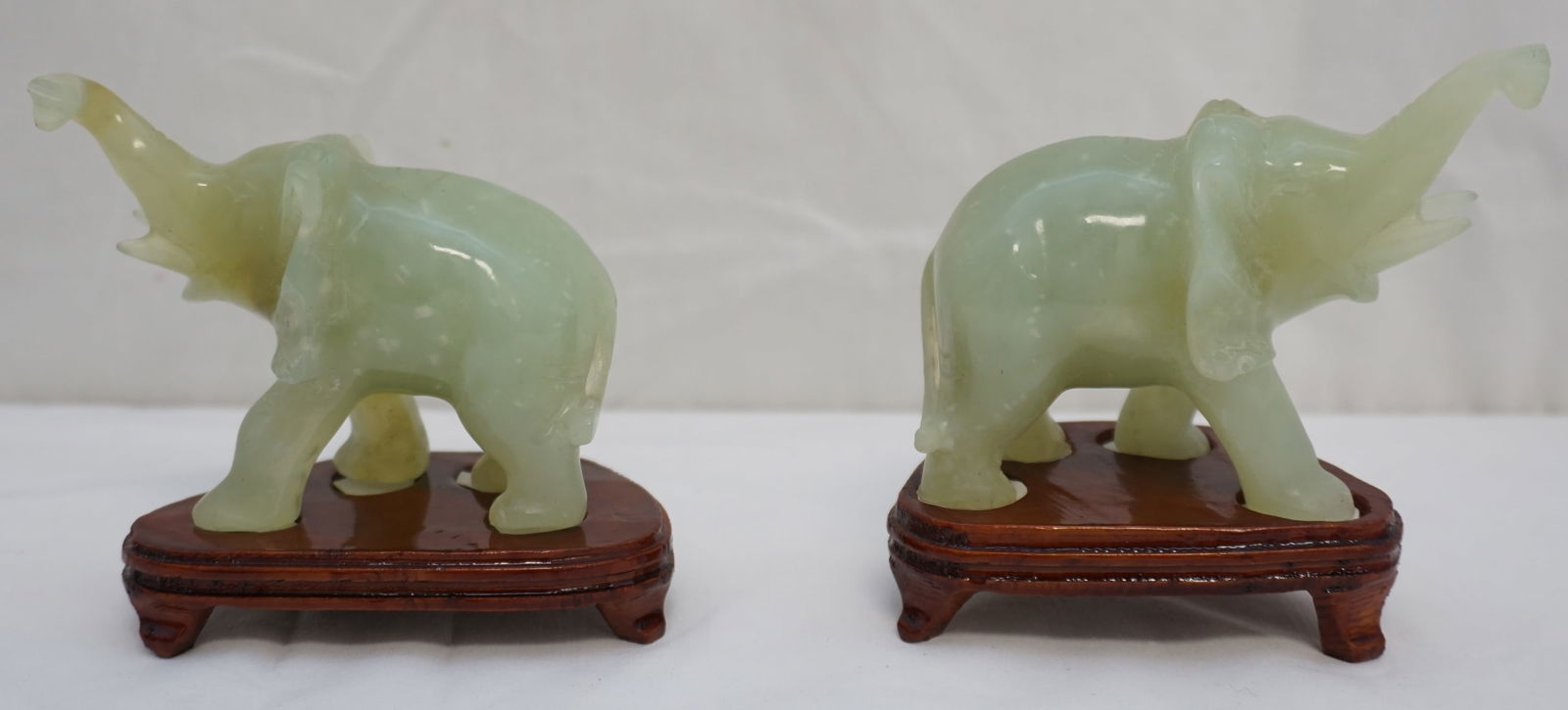 Pair Of Carved Jade Elephants With Stands Auction