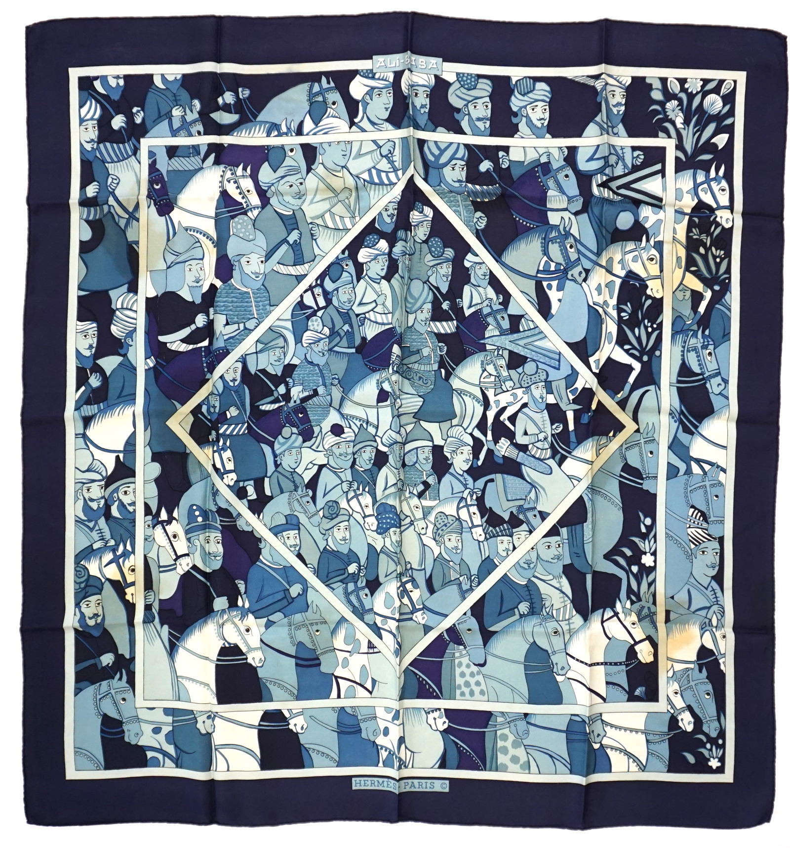 HERMES PARIS "ALI BABA" SILK SCARF: HERMES PARIS silk “Ali Baba” scarf. The scarf showcases elegant drawings of mounted Arabian horses highlighted by a color palette that includes various tones of blue and white. Drawn by Pi